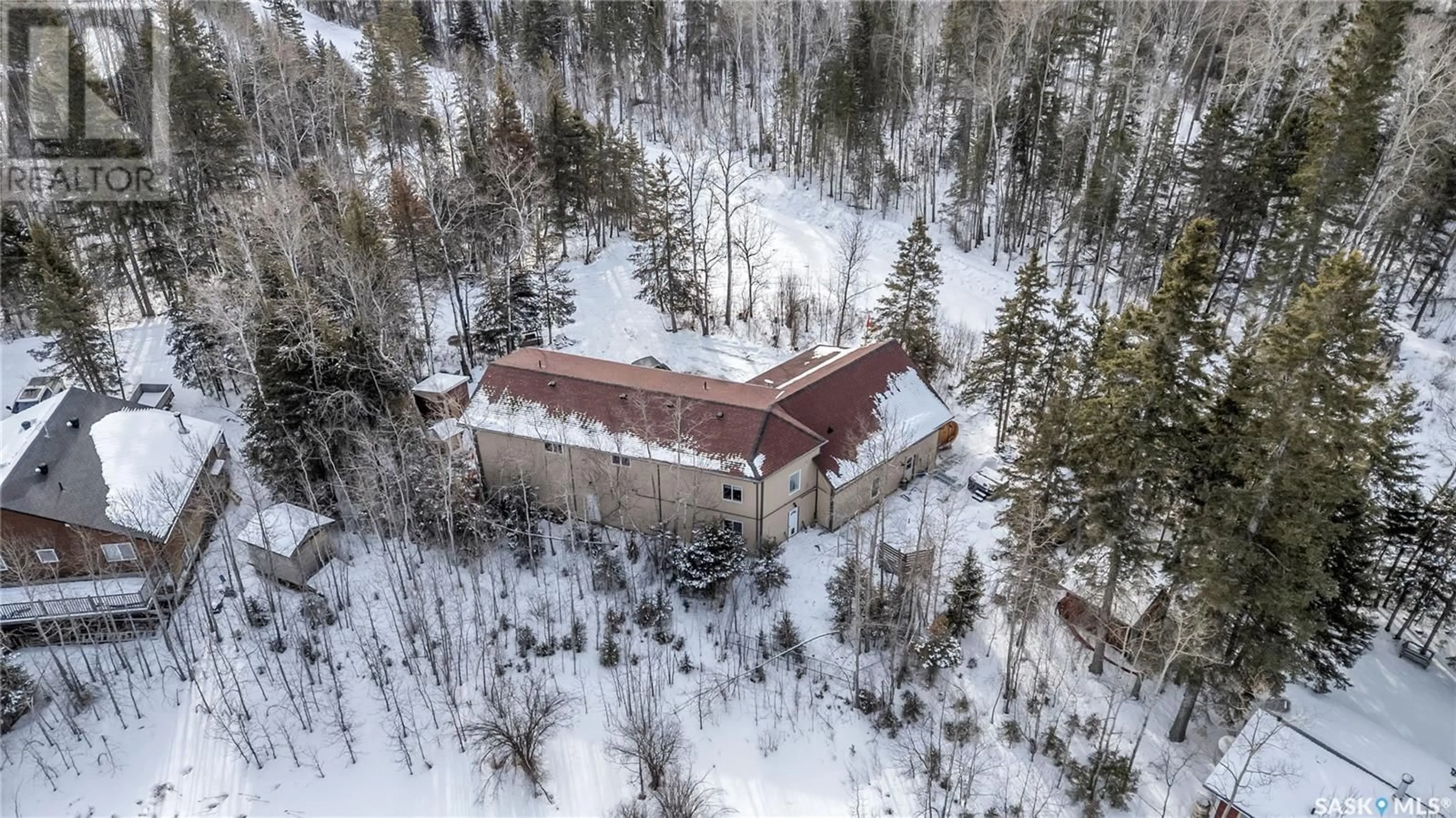 A pic from outside/outdoor area/front of a property/back of a property/a pic from drone, building for 102 MOORE DRIVE, Christopher Lake Saskatchewan S0J0N0