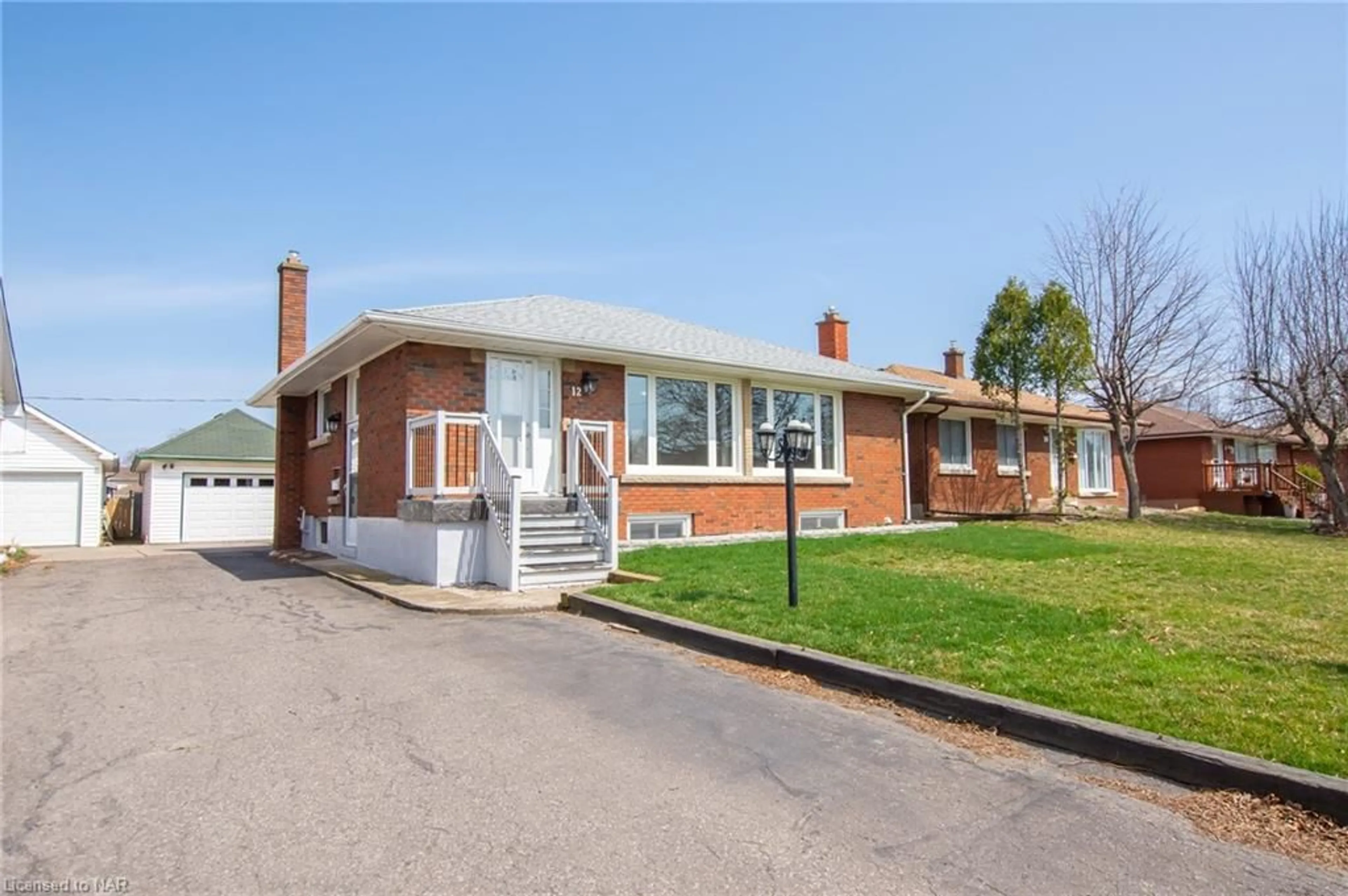 Home with brick exterior material for 12 Milton Rd, St. Catharines Ontario L2P 3E8