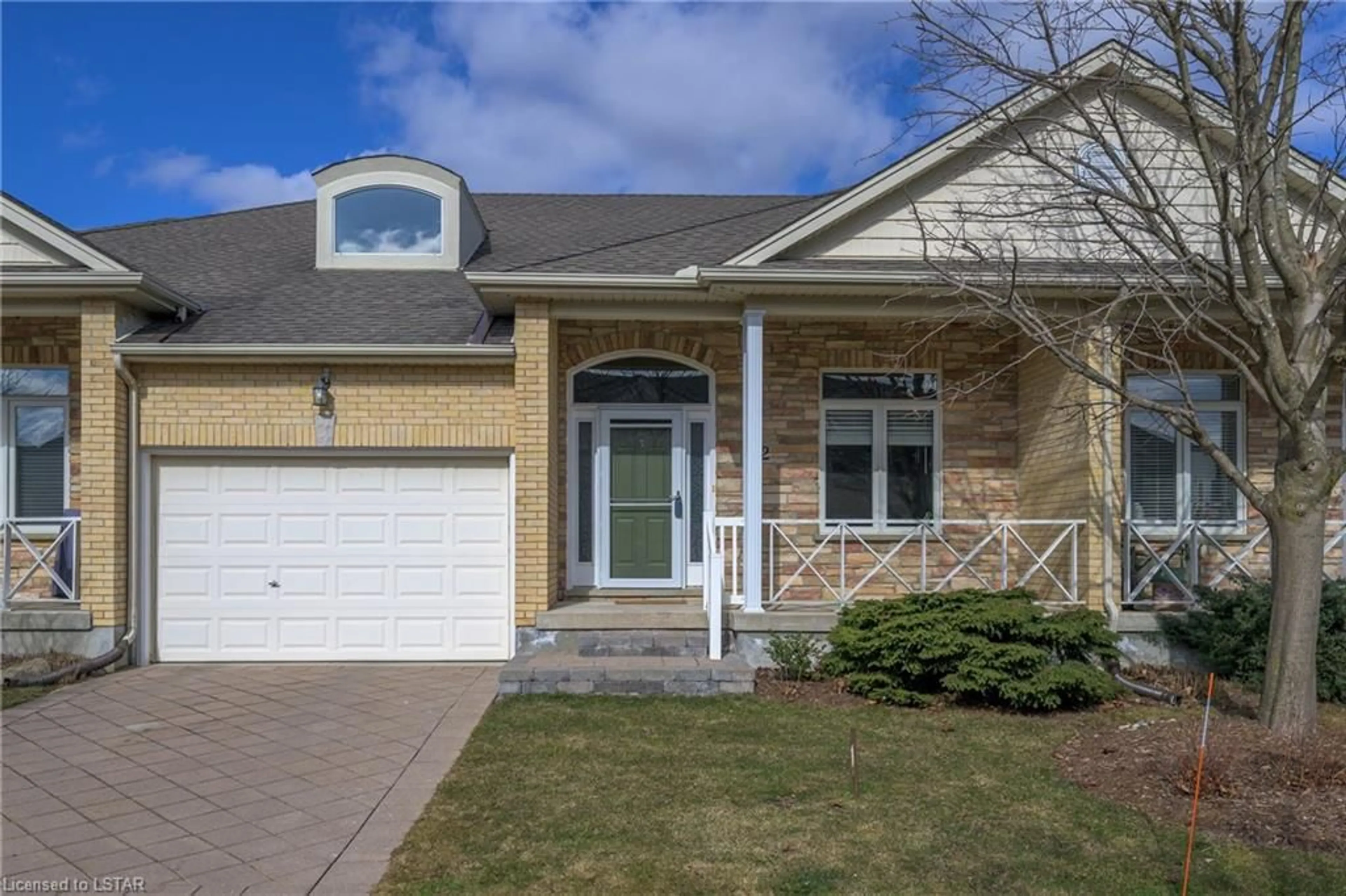Home with brick exterior material for 947 Adirondack Rd #2, London Ontario N6K 4Y7