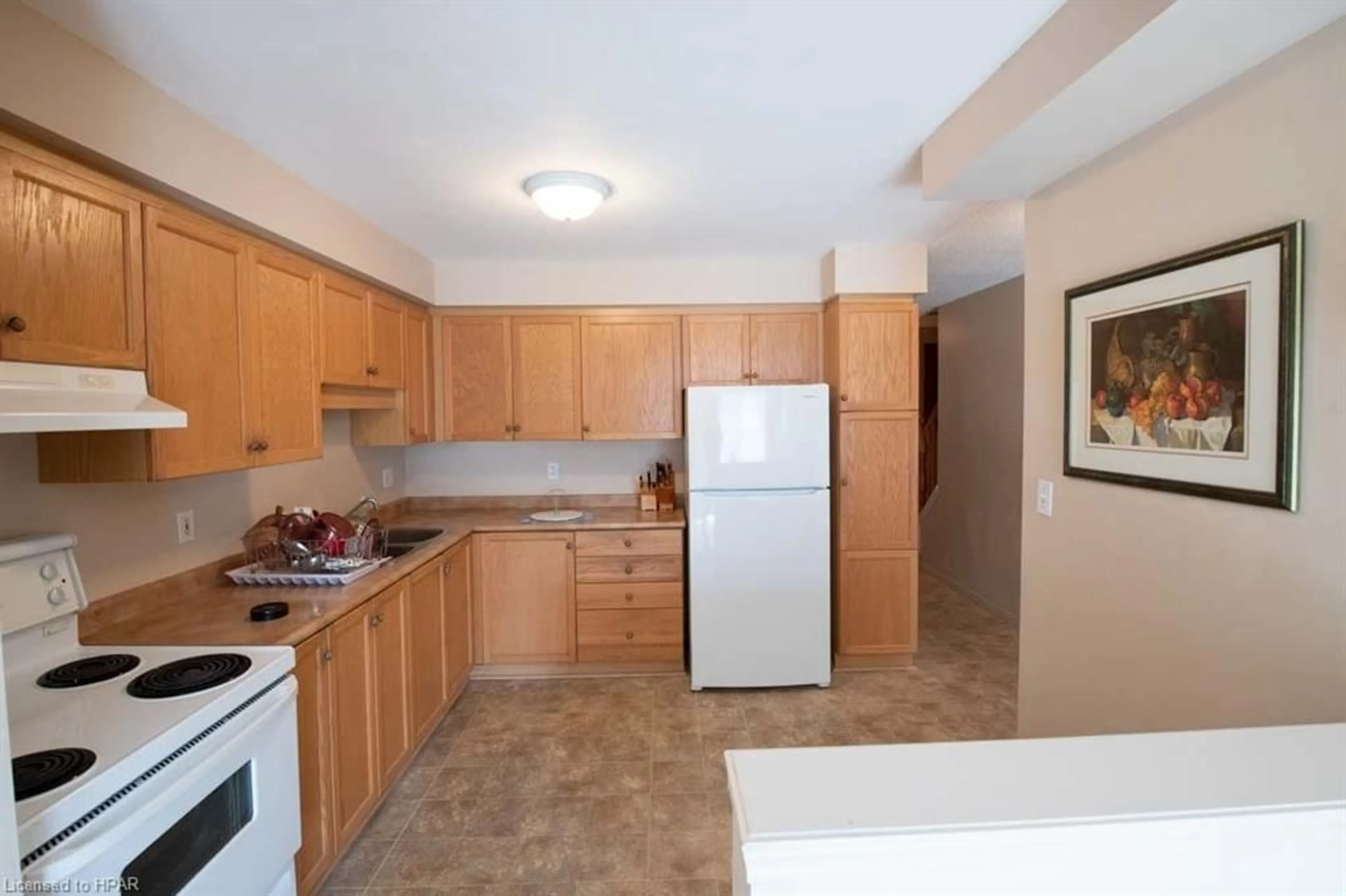 Standard kitchen, wood floors, cottage for 30 Imperial Rd #113, Guelph Ontario N1K 1Y5