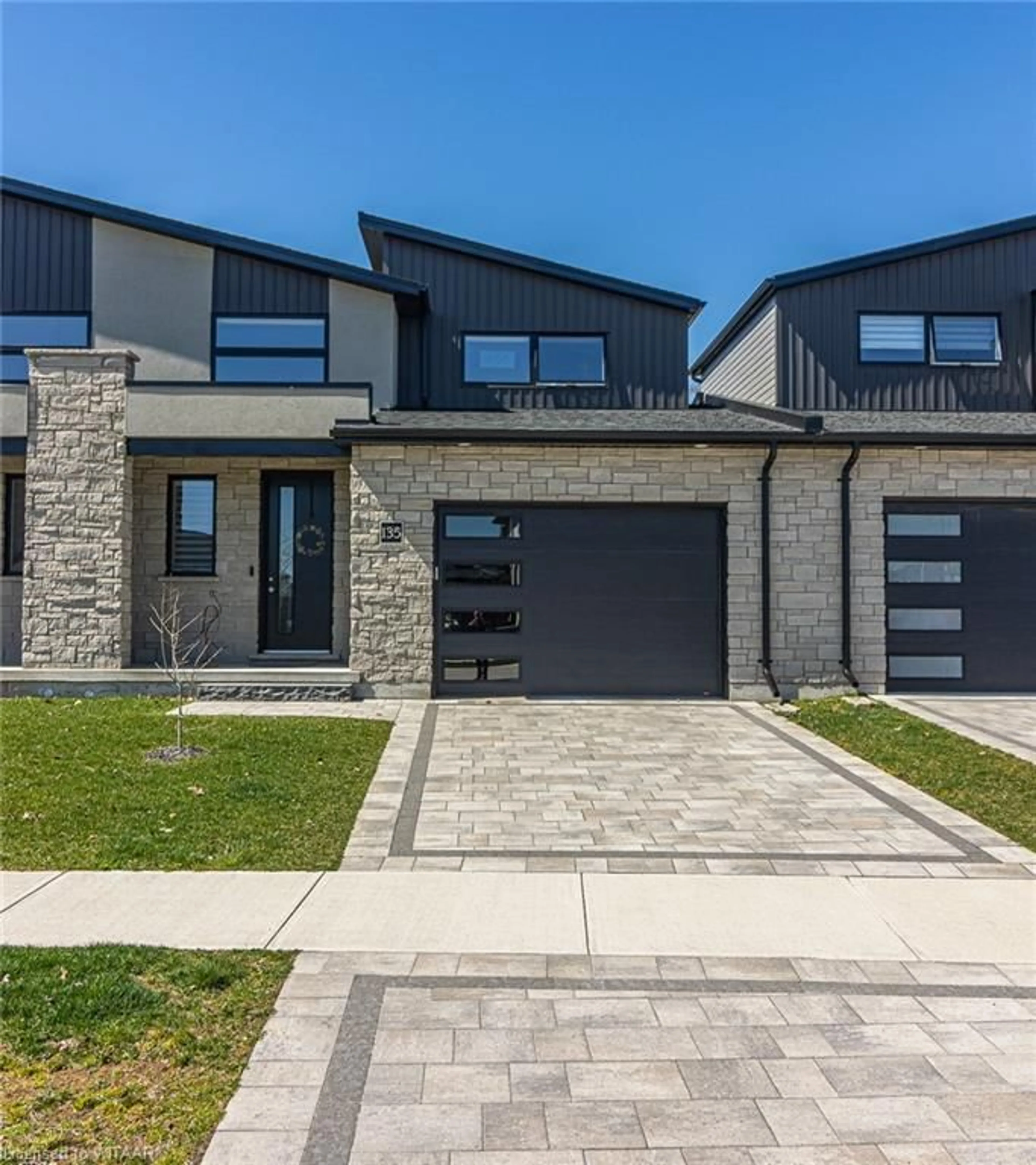 Home with brick exterior material for 135 Tamarack Blvd, Woodstock Ontario N4S 0E2