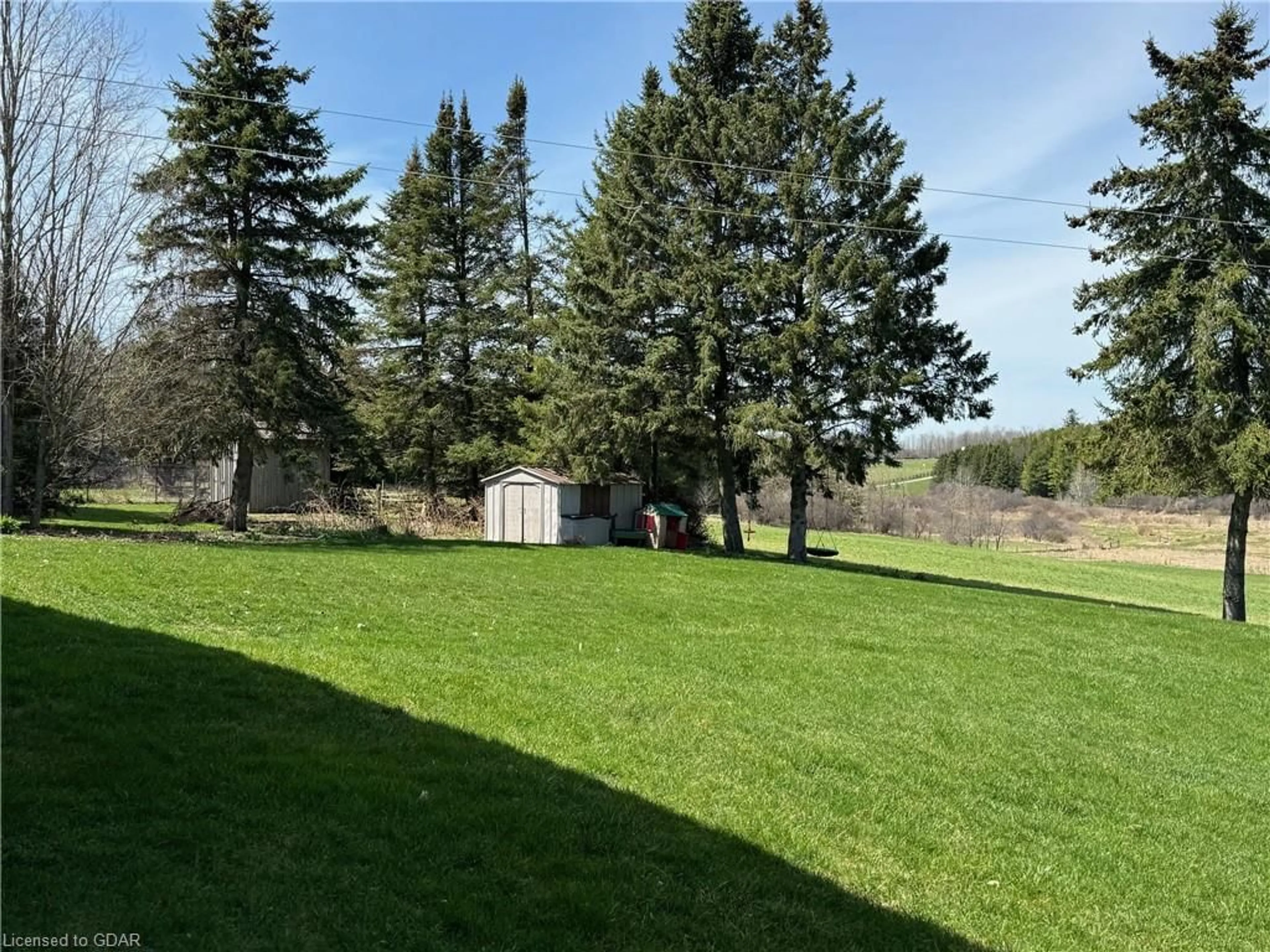 A pic from exterior of the house or condo, the fenced backyard for 7680 Eighth Line, Guelph Ontario N1H 6J2