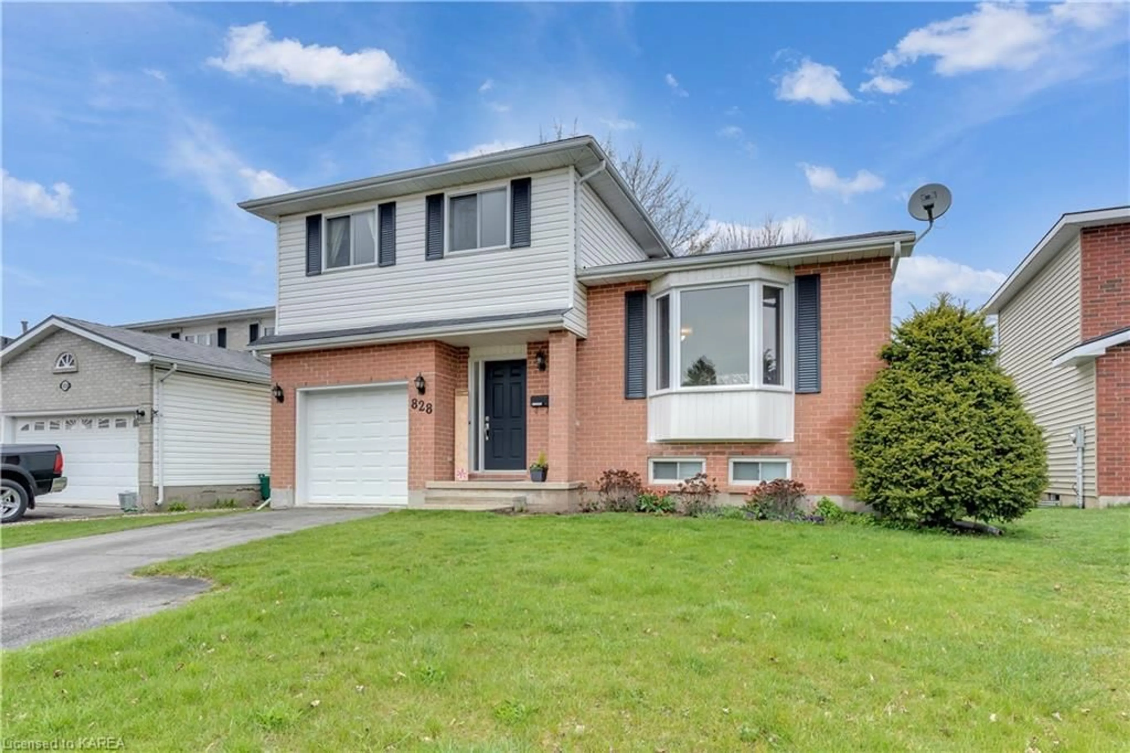 Frontside or backside of a home for 828 Cataraqui Woods Dr, Kingston Ontario K7P 2P7