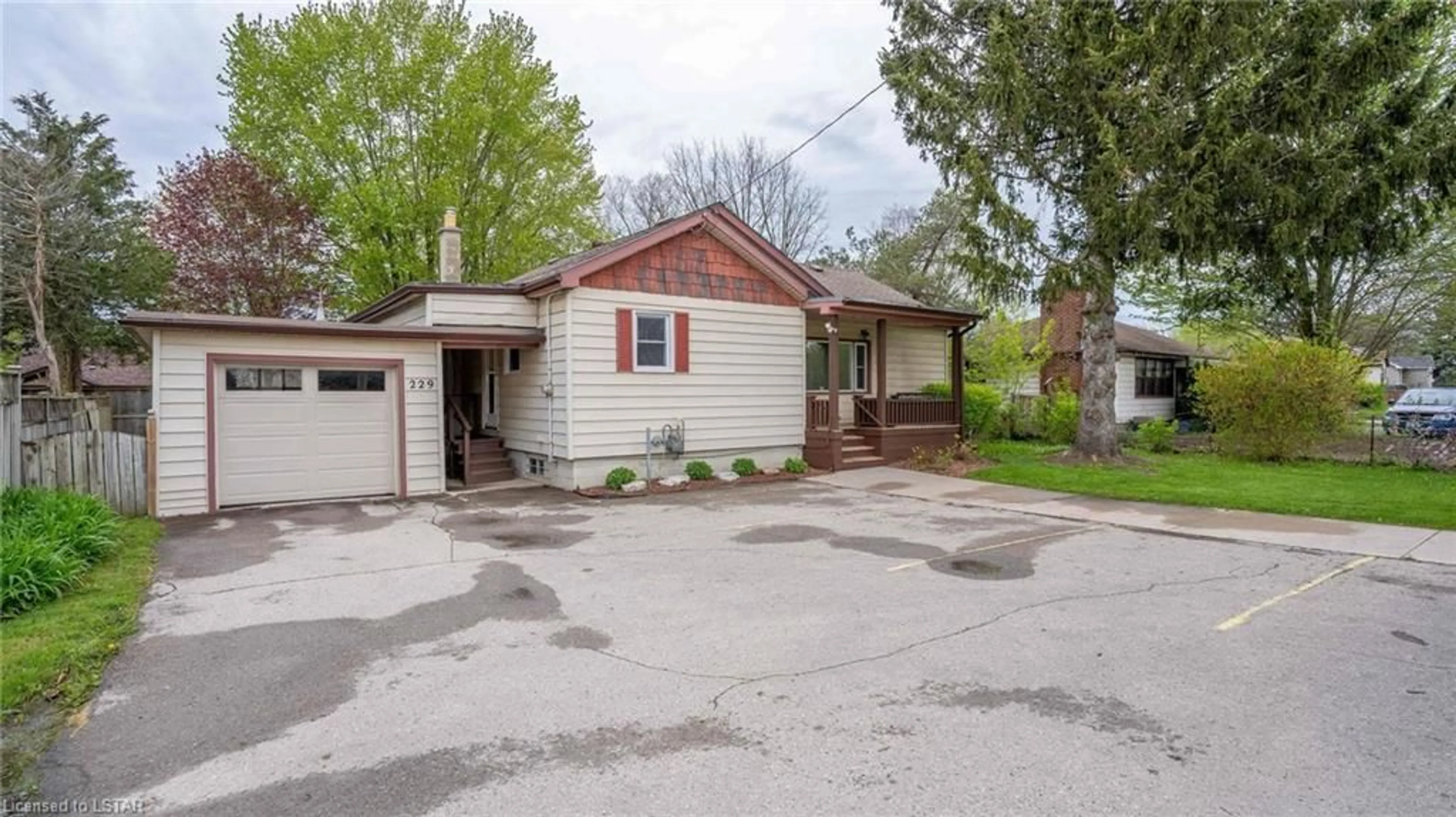 Frontside or backside of a home for 229 Clarke Rd, London Ontario N5W 5E6