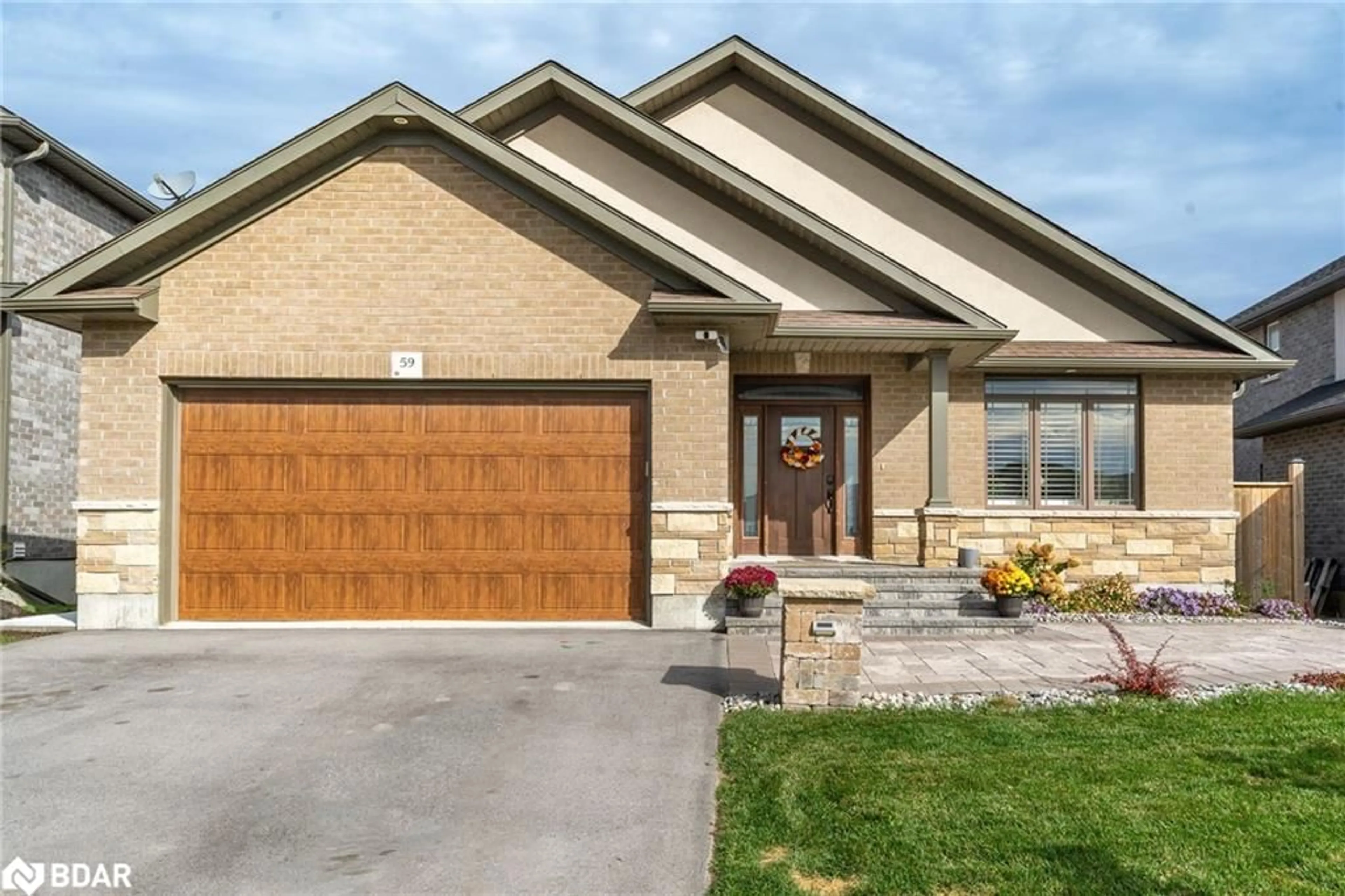 Home with brick exterior material for 59 Hampton Ridge Dr, Belleville Ontario K8N 0E6