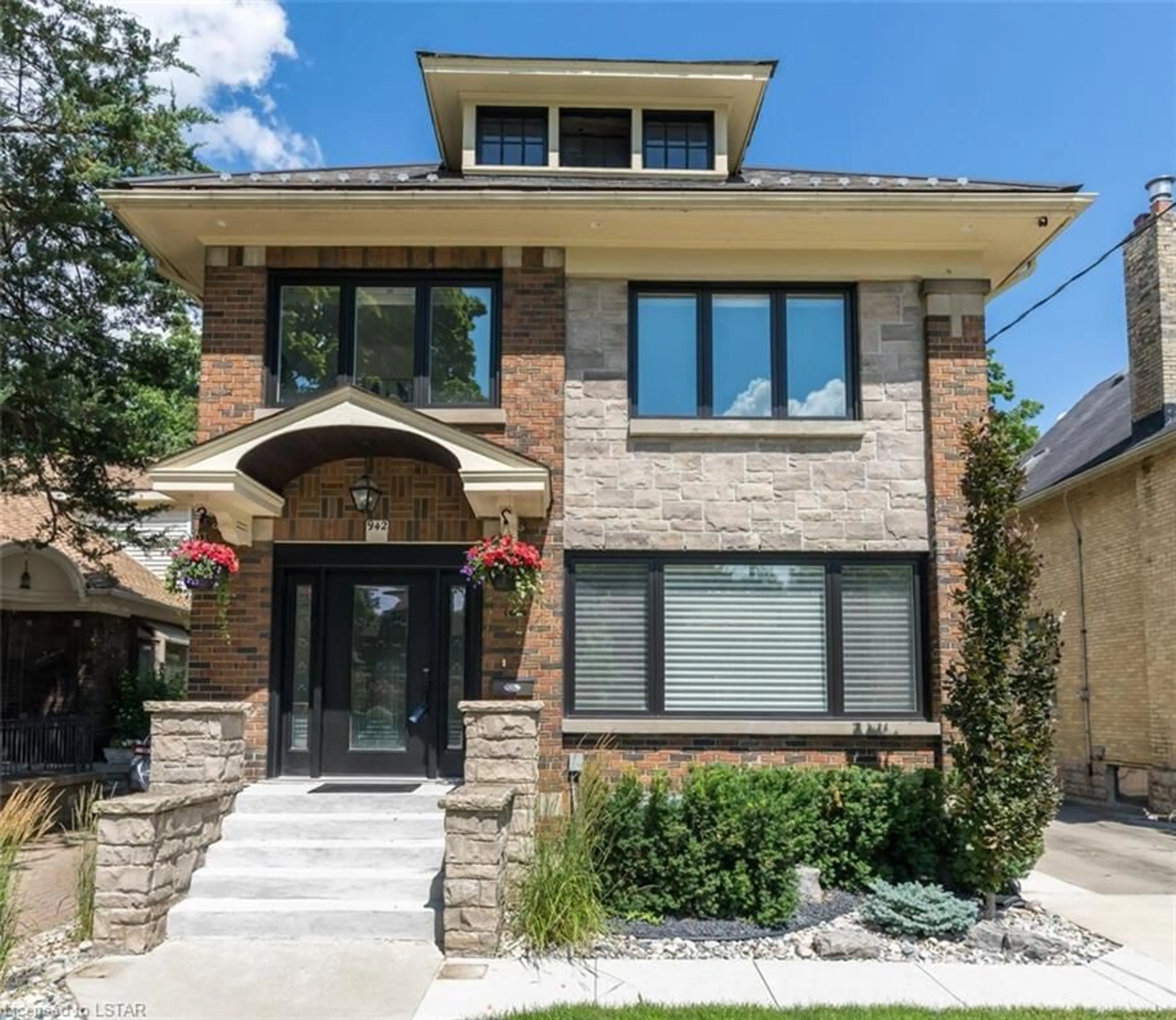 Home with brick exterior material for 942 Wellington St, London Ontario N6A 3S9