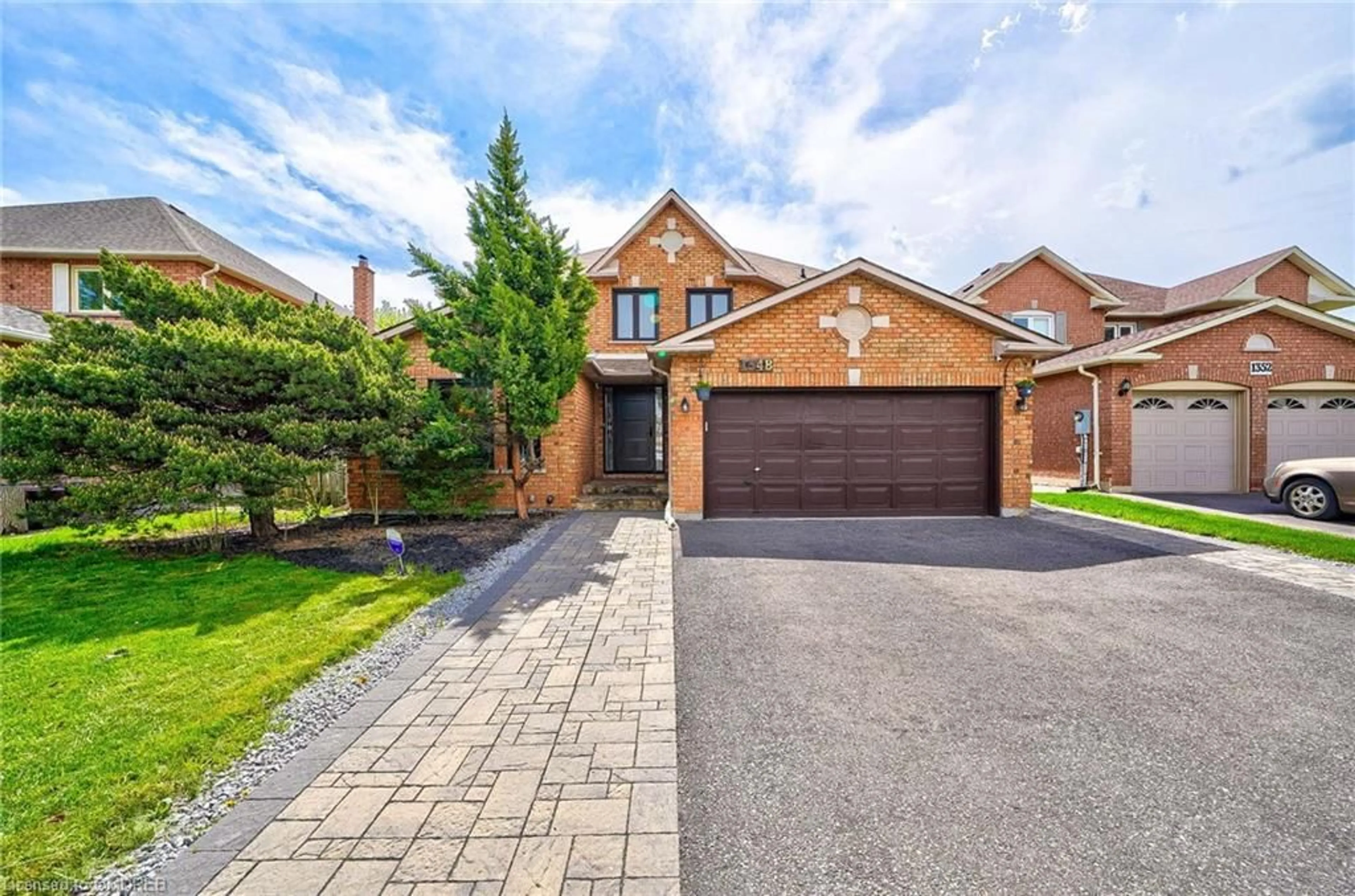Home with brick exterior material for 1348 Pilgrims Way, Oakville Ontario L6M 2M1