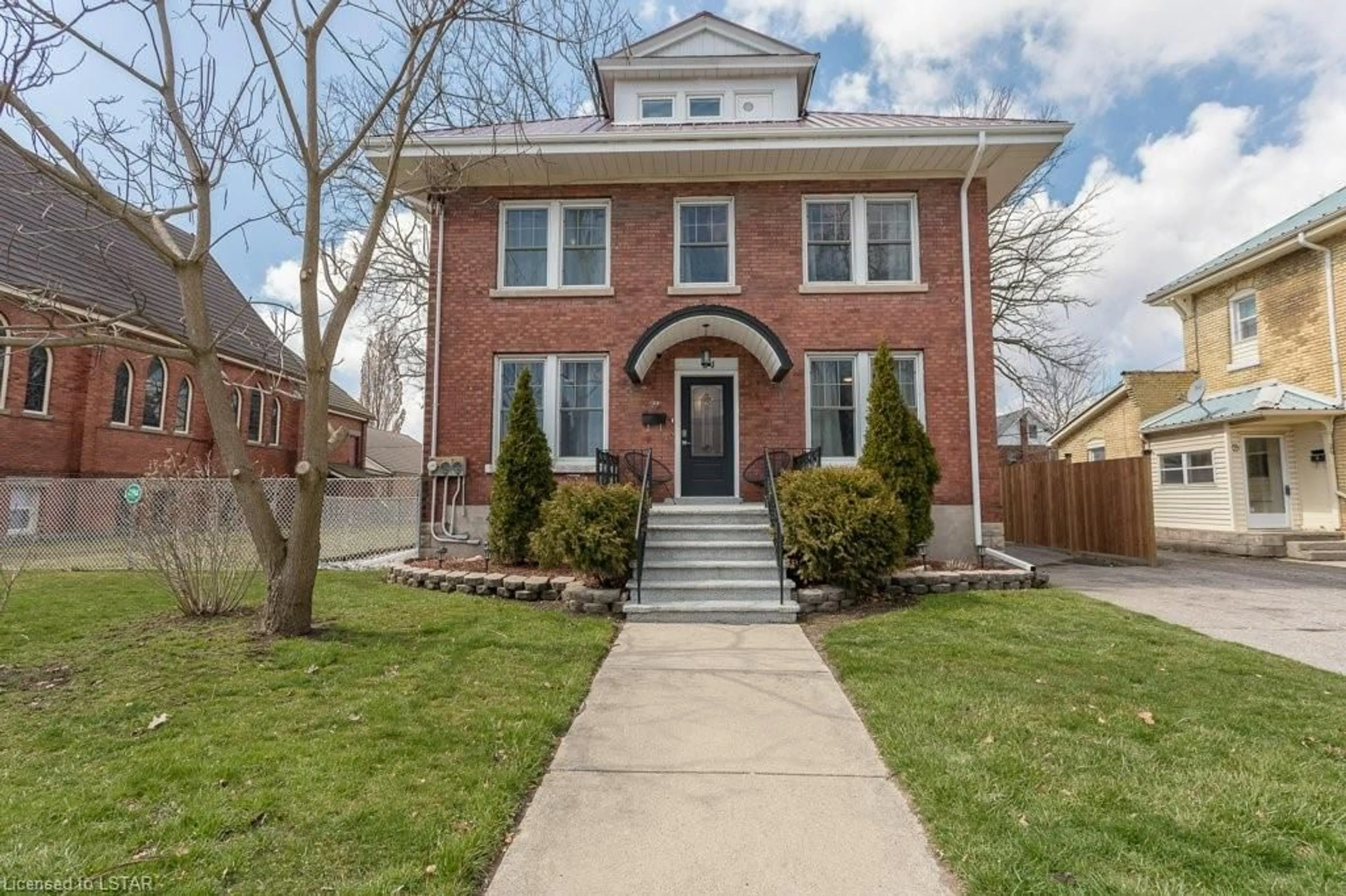 Home with brick exterior material for 24 Flora St, St. Thomas Ontario N5P 2X4