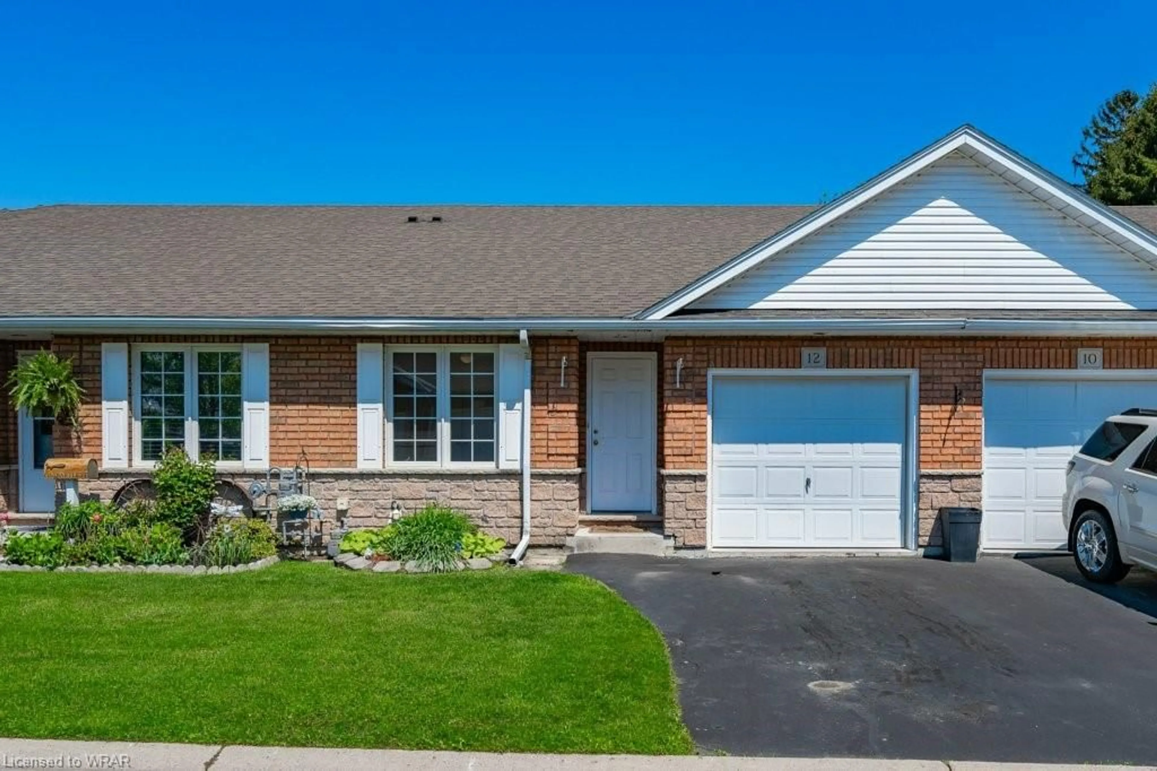 Home with brick exterior material for 12 Clonmel Lane, Port Dover Ontario N0A 1N1
