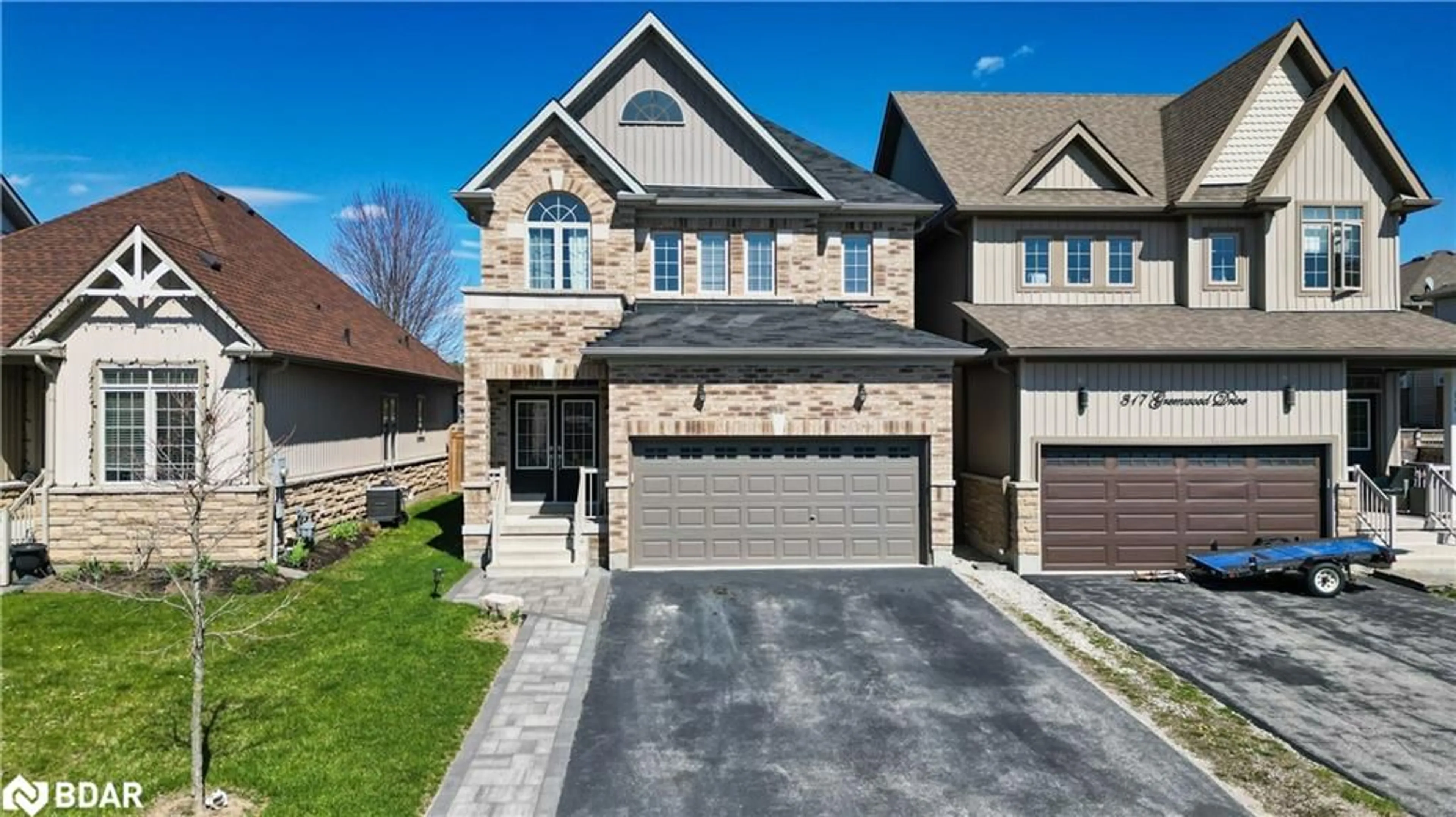 Home with brick exterior material for 315 Greenwood Dr, Essa Ontario L3W 038