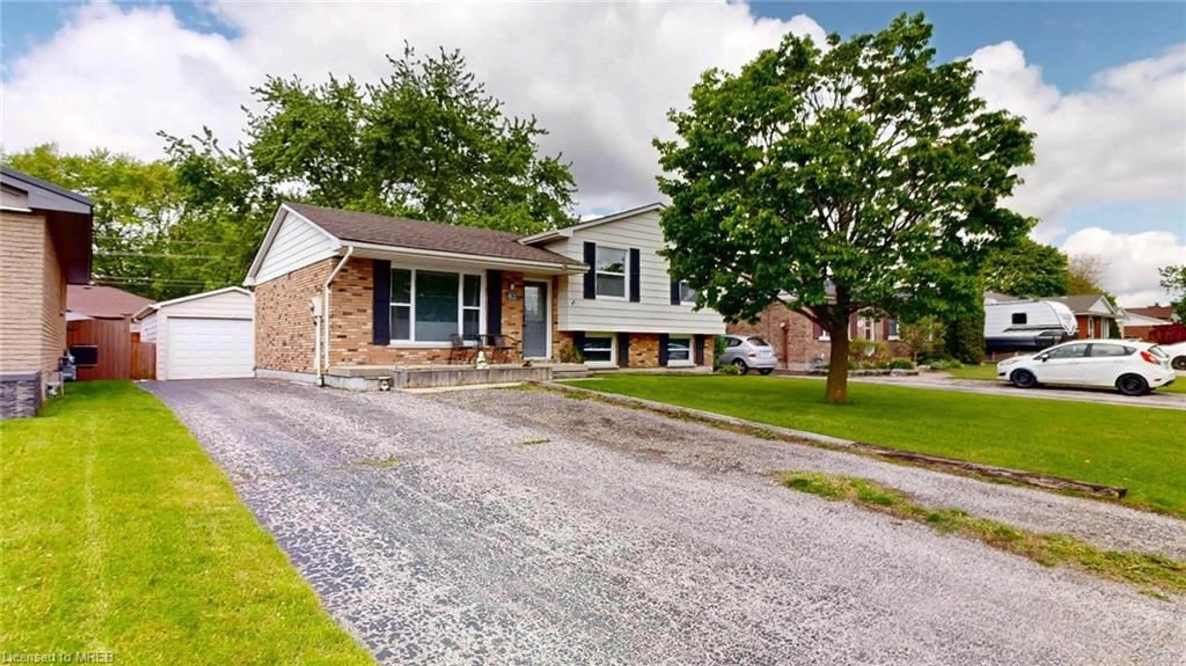 Home with brick exterior material for 82 Moore Ave, Aylmer Ontario N5H 2Z9