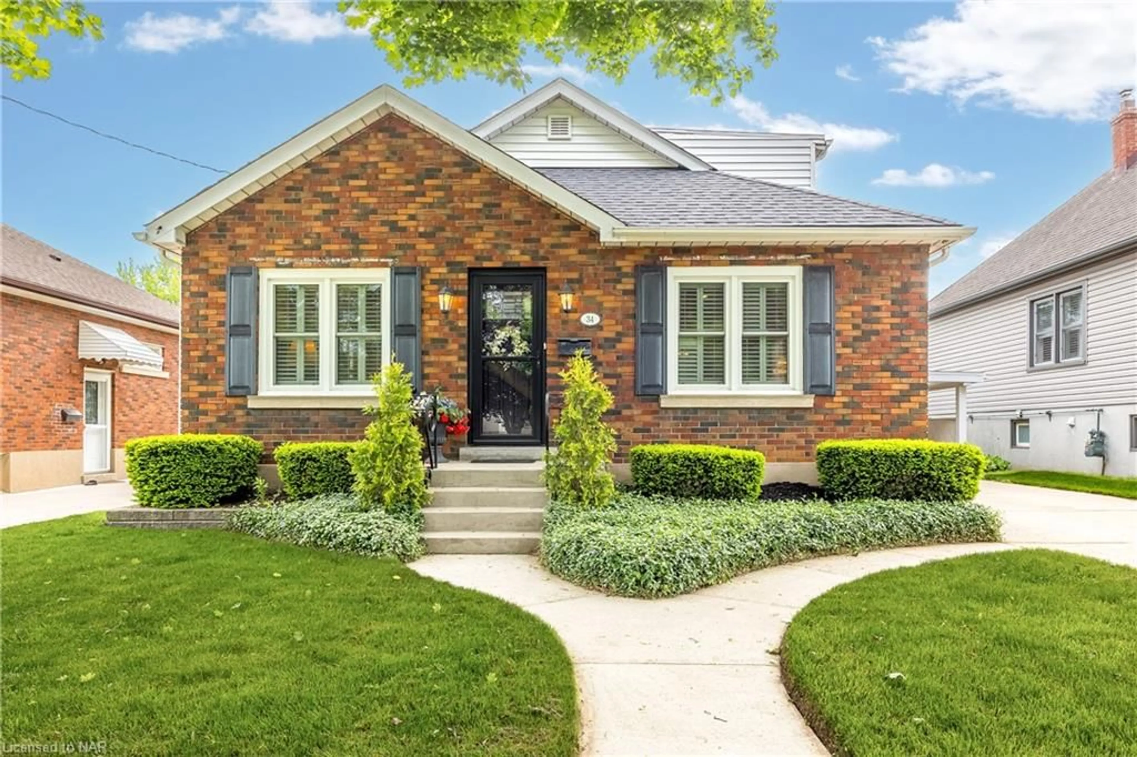 Home with brick exterior material for 34 Rolls Ave, St. Catharines Ontario L2N 1W1
