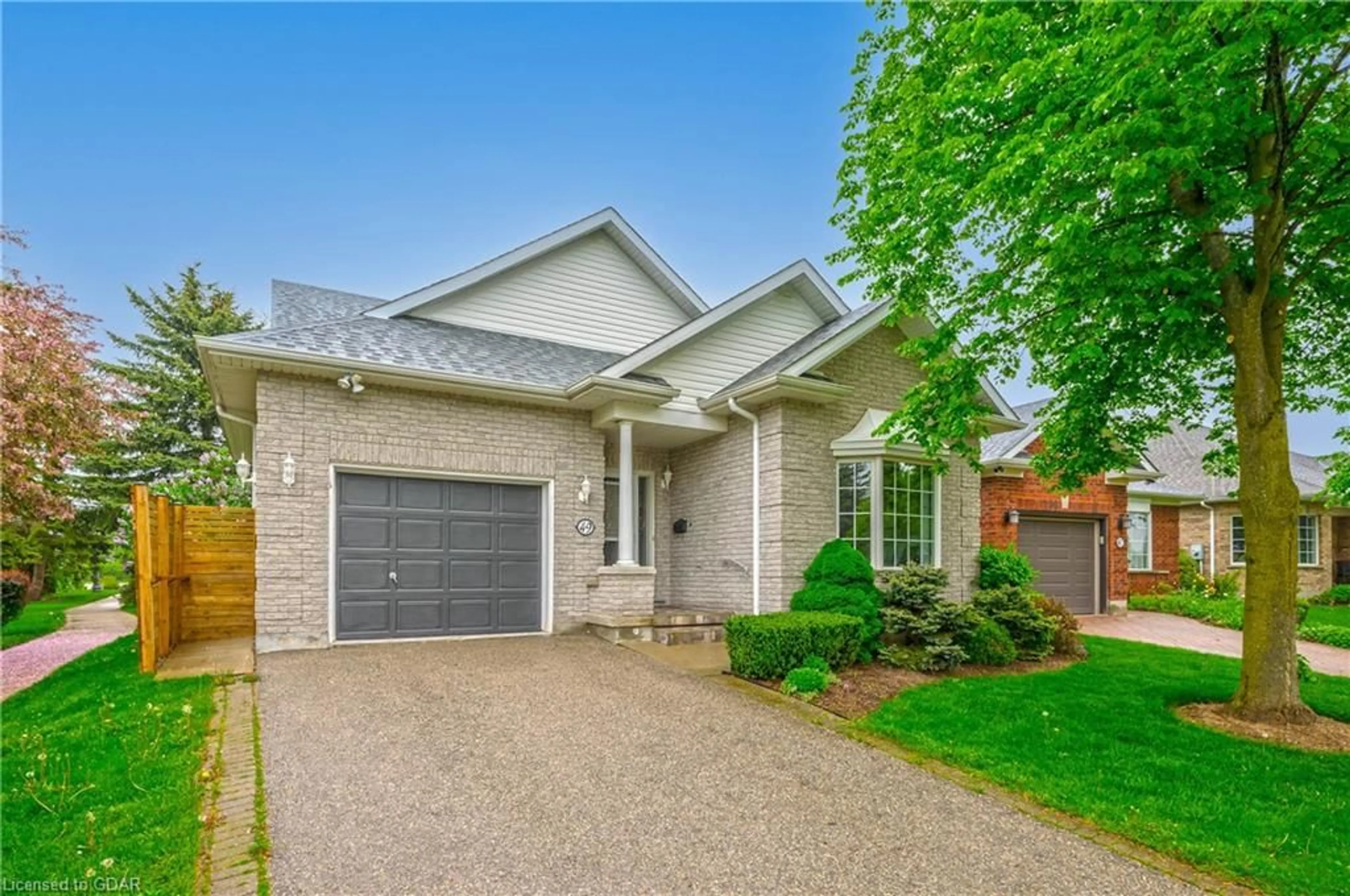 Home with brick exterior material for 49 Cherry Blossom Cir, Guelph Ontario N1G 4X7