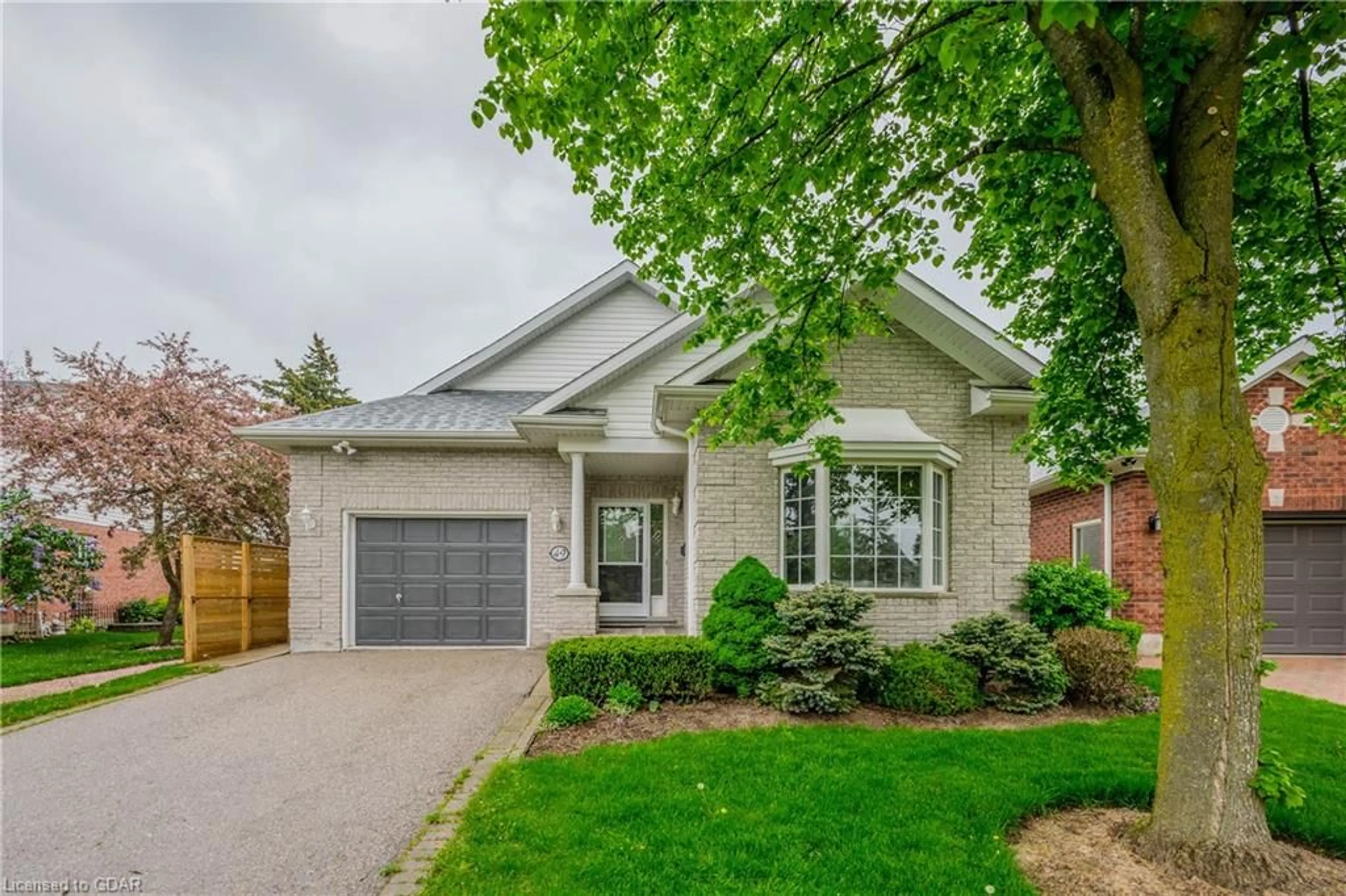 Home with brick exterior material for 49 Cherry Blossom Cir, Guelph Ontario N1G 4X7