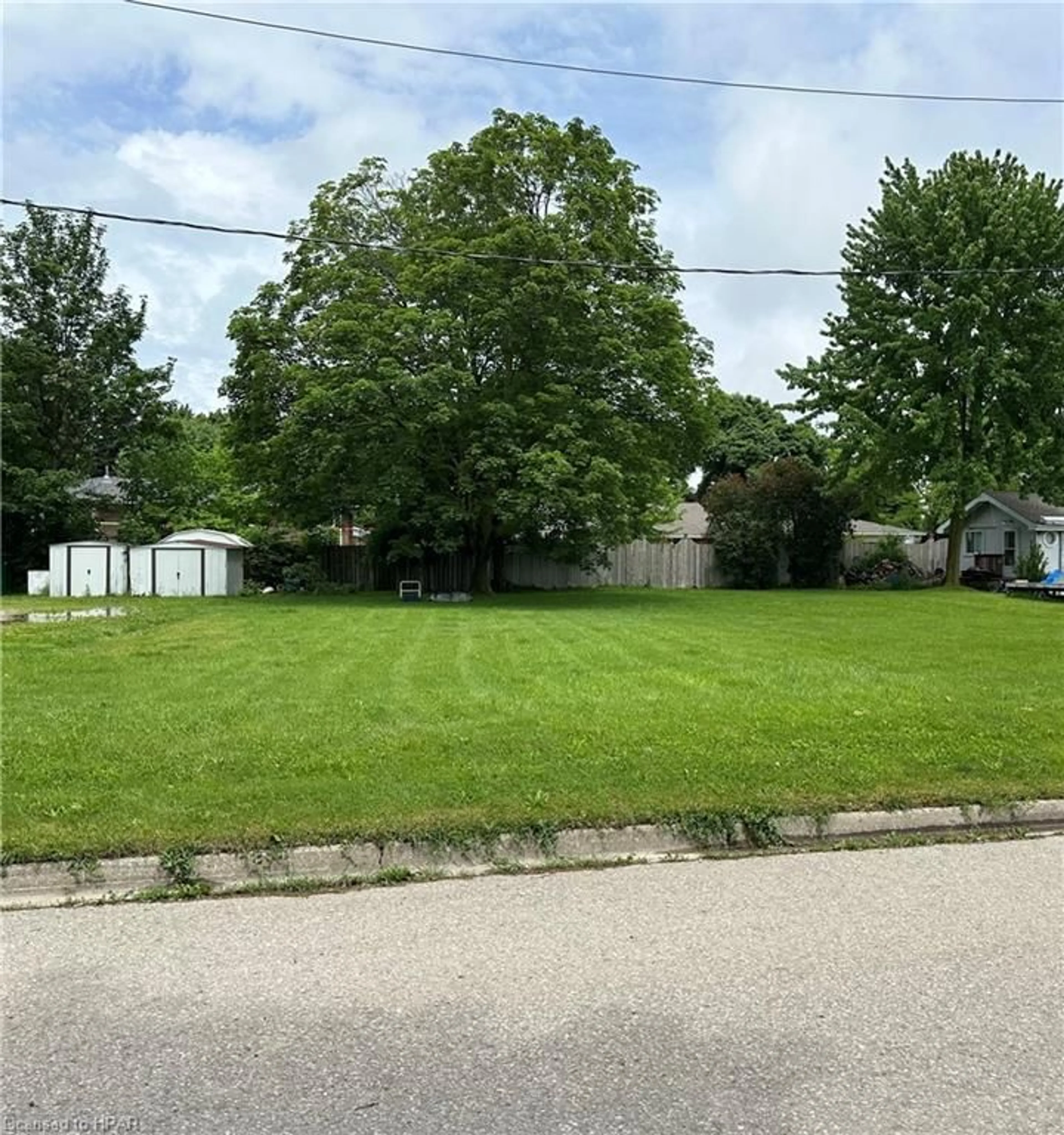 Frontside or backside of a home, the fenced backyard for 153 Bruce St, Goderich Ontario N7A 1T1