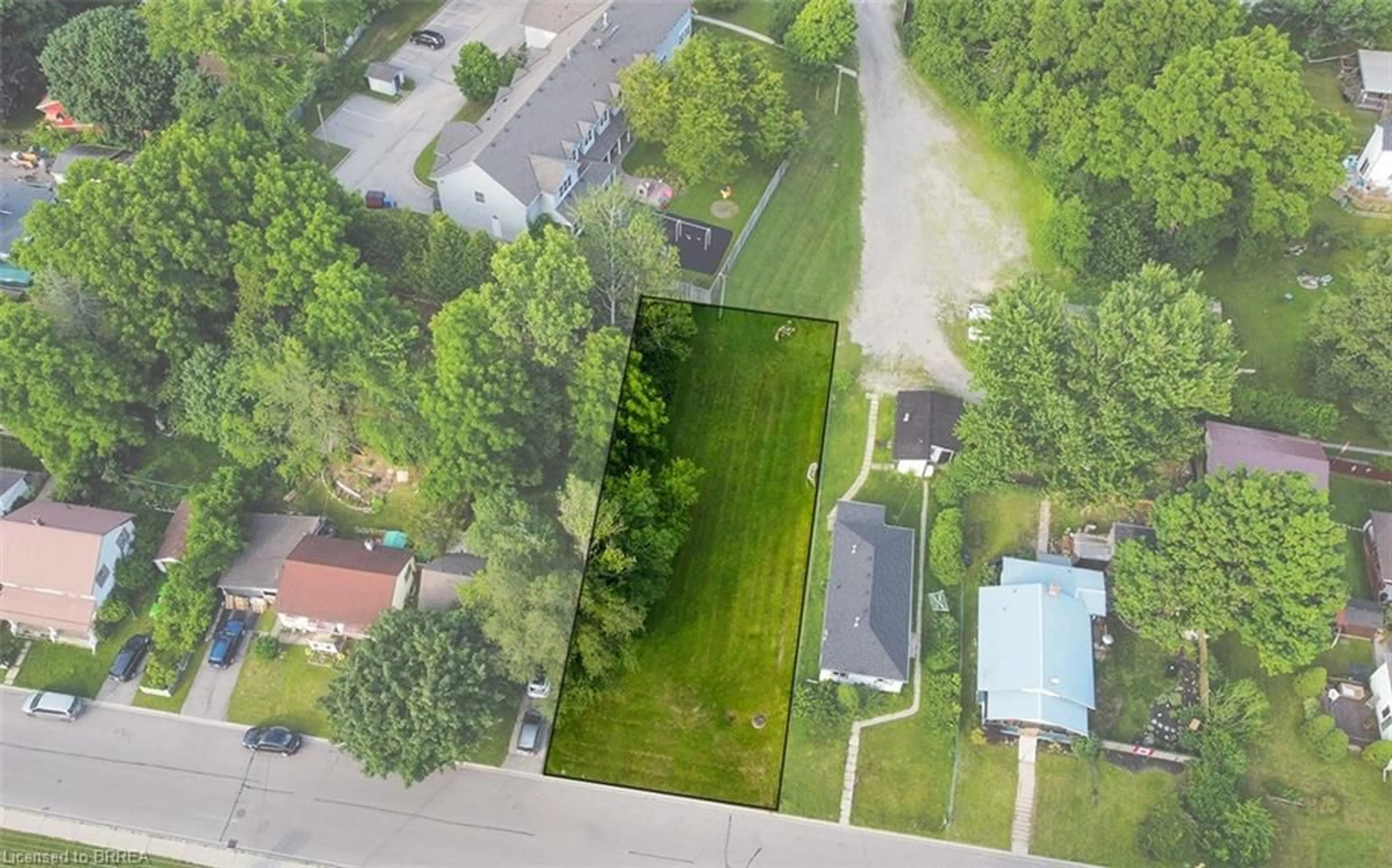 Frontside or backside of a home, the fenced backyard for 171 Sherman Ave, Simcoe Ontario N3Y 2T2