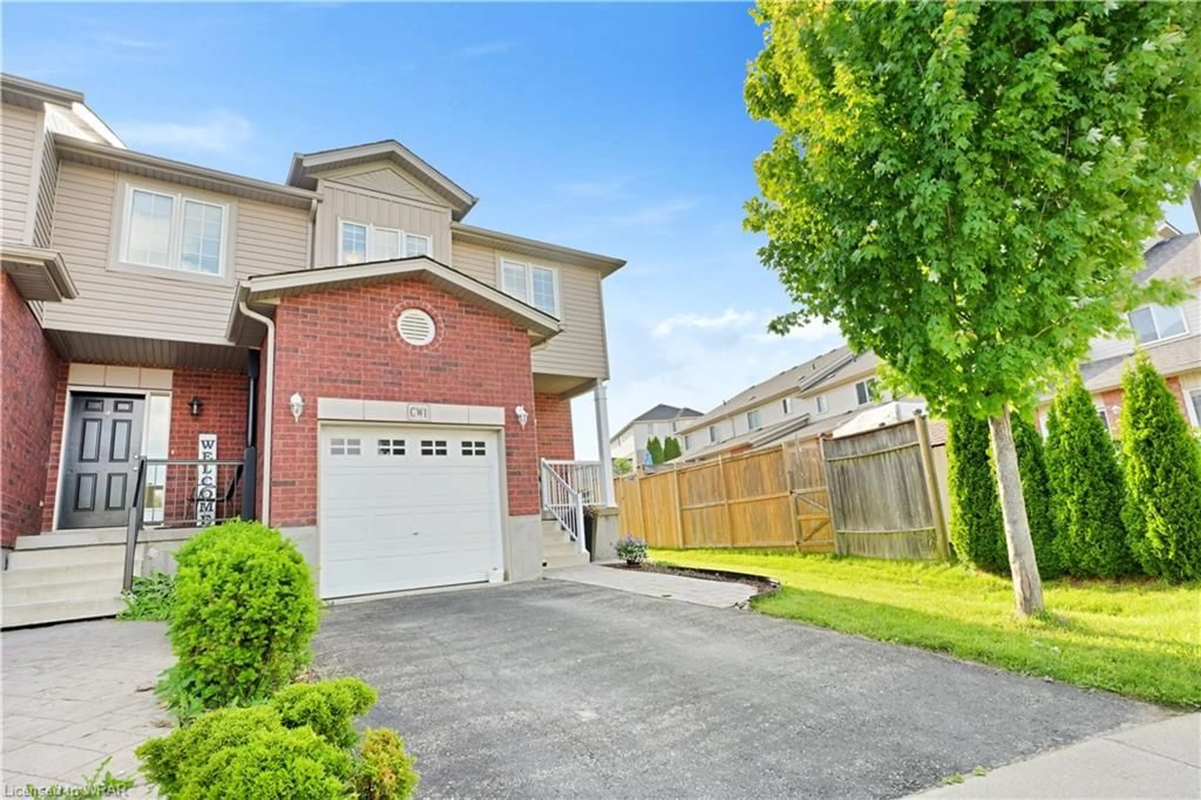 Frontside or backside of a home for 305 Briarmeadow Dr #1, Kitchener Ontario N2A 4K9