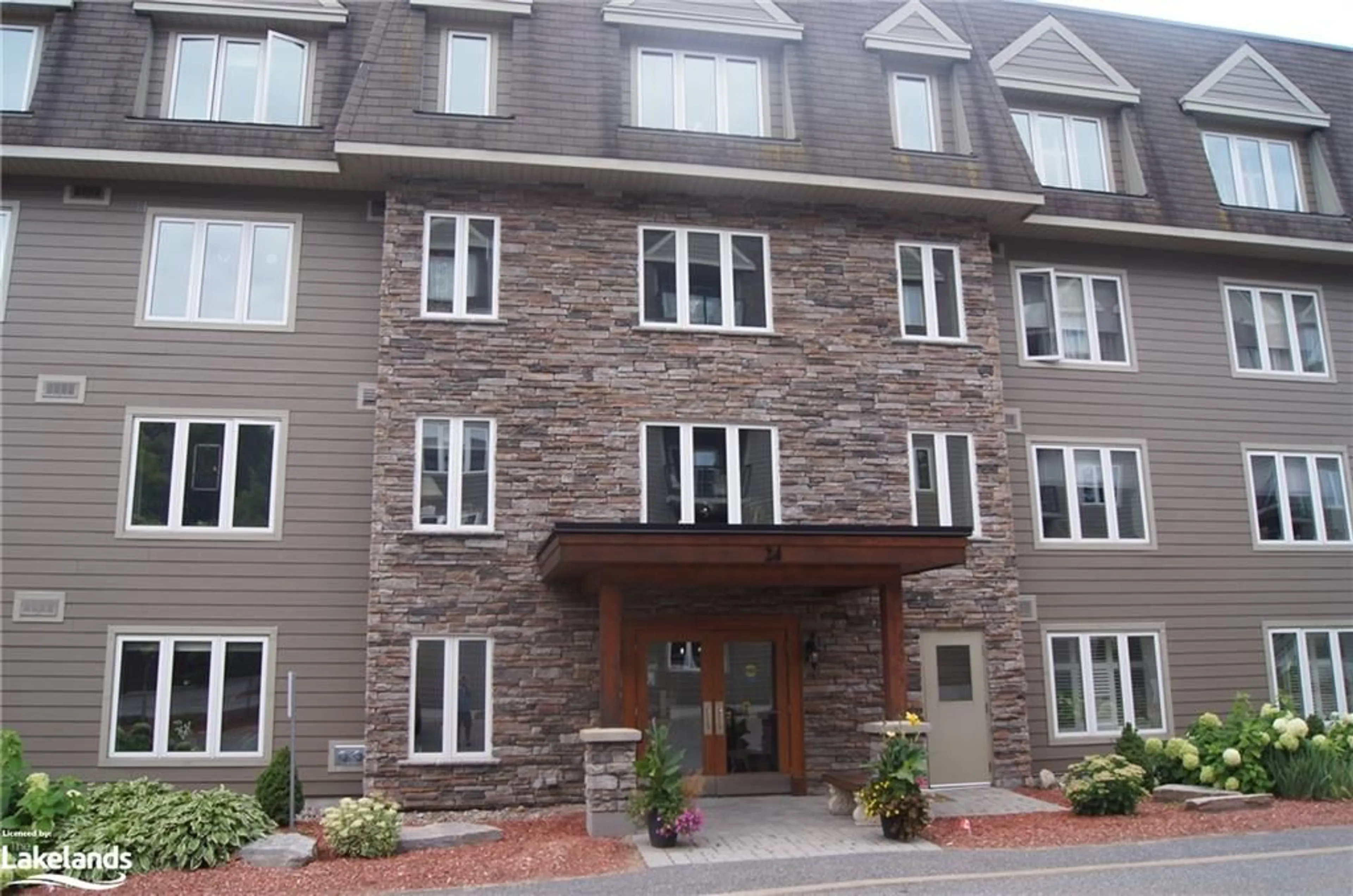 A pic from exterior of the house or condo for 24 Dairy Lane #301, Huntsville Ontario P1H 0A4
