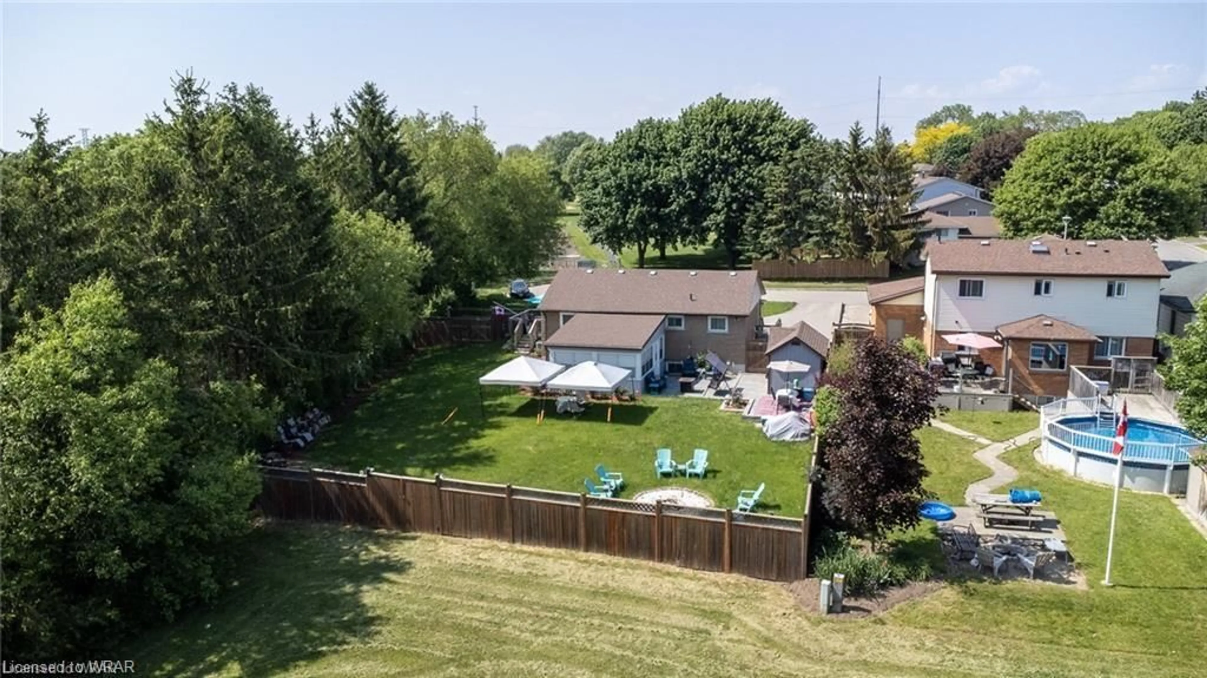 Frontside or backside of a home, the fenced backyard for 732 Salter Ave, Woodstock Ontario N4S 2P5