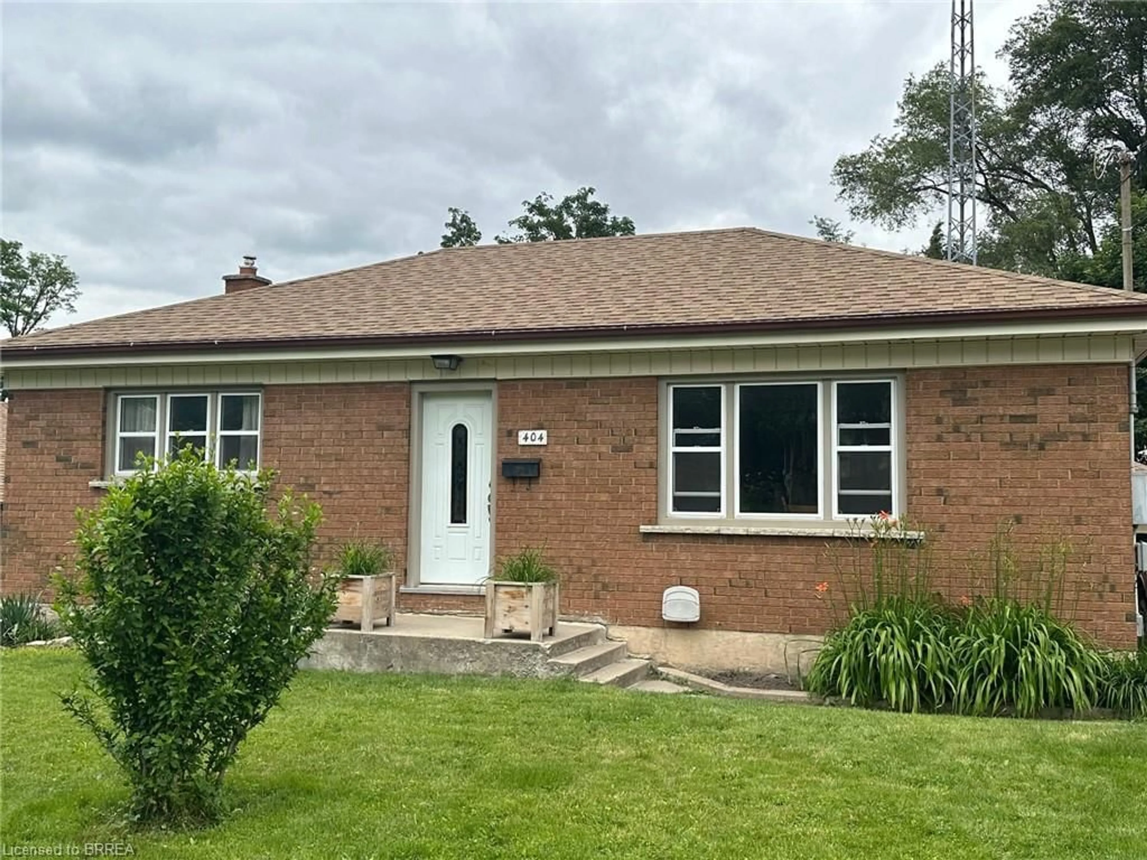 Home with brick exterior material for 404 Chatham St, Brantford Ontario N3S 4S5