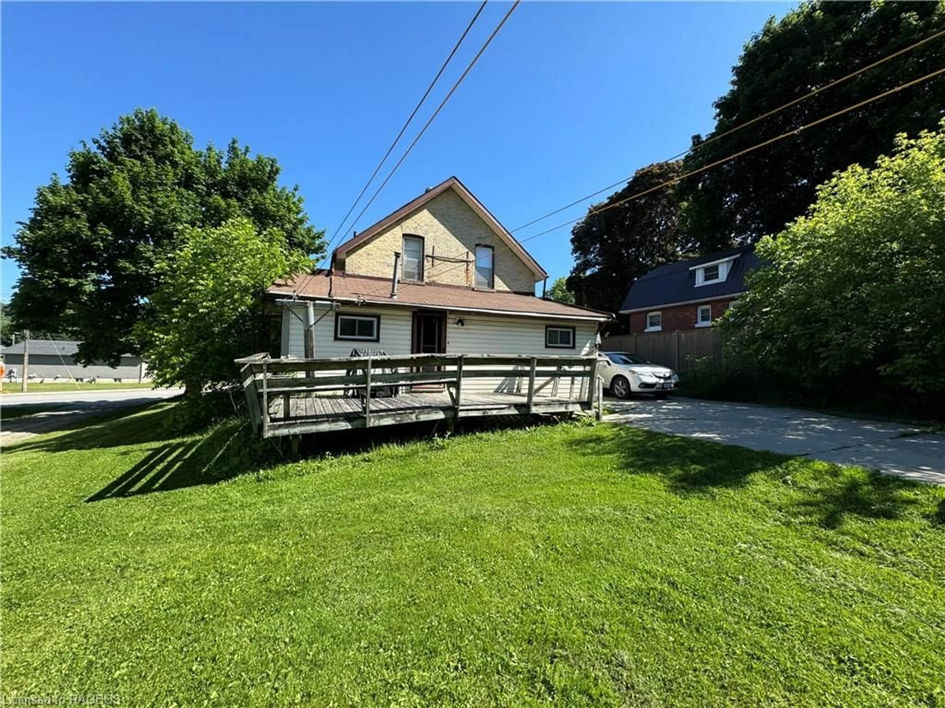 Frontside or backside of a home, the fenced backyard for 715 Durham St, Walkerton Ontario N0G 2V0