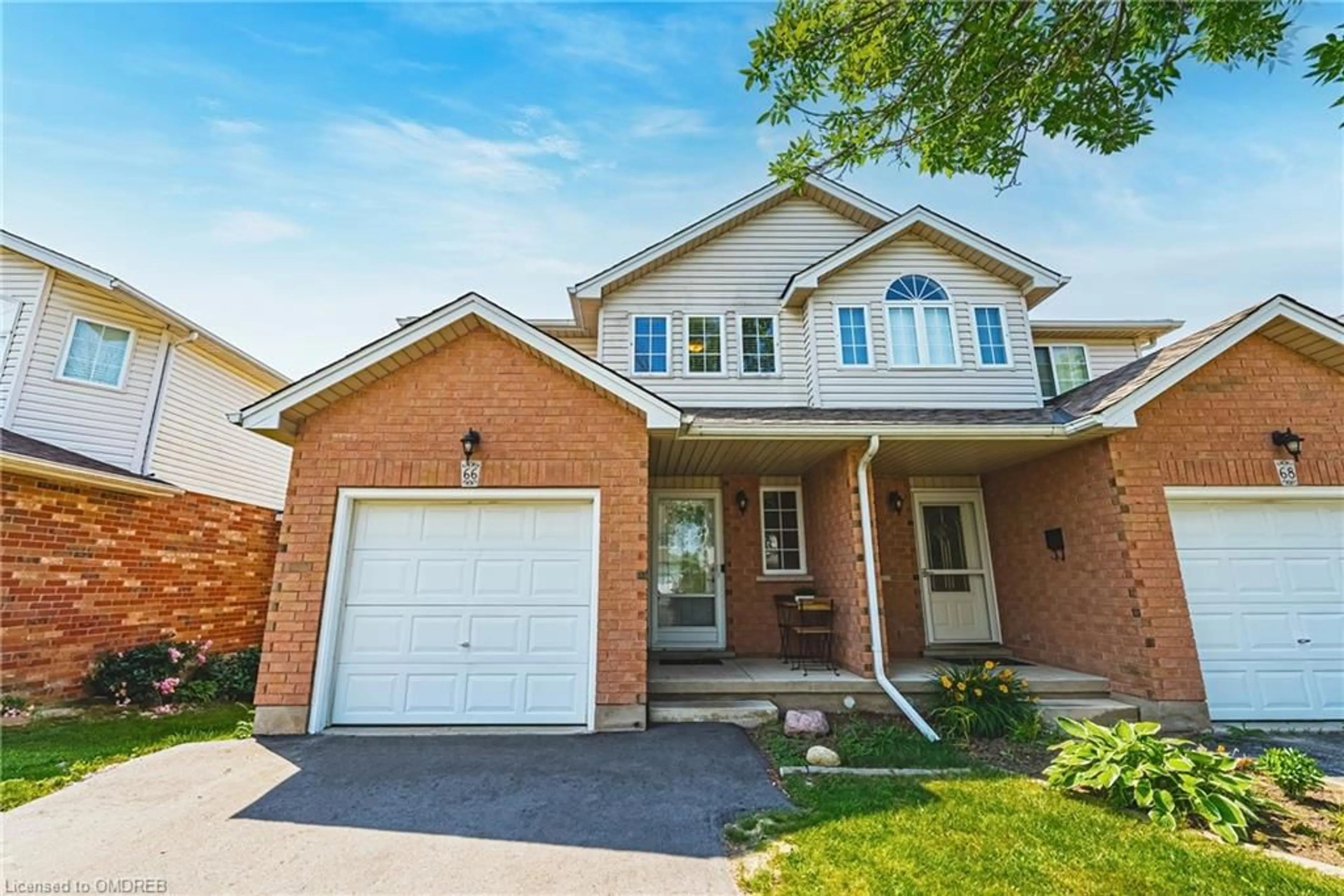 Home with brick exterior material for 66 Raspberry Lane, Guelph Ontario N1E 7H4