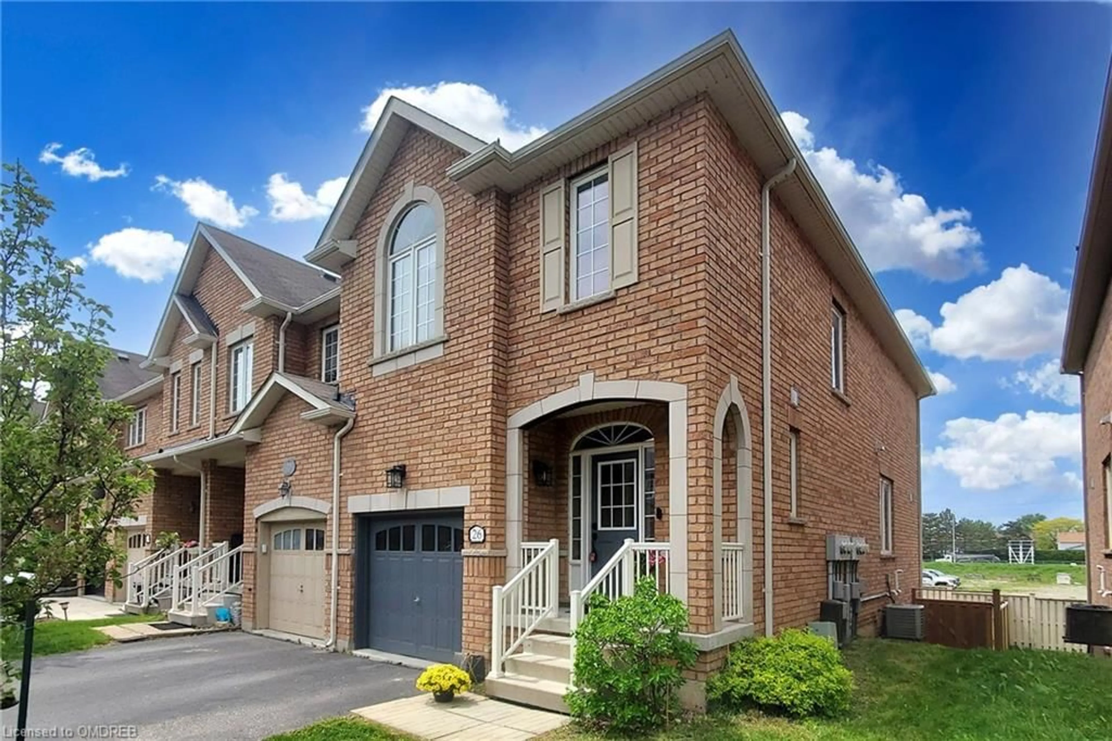 A pic from exterior of the house or condo for 651 Farmstead Dr #26, Milton Ontario L9T 7W2