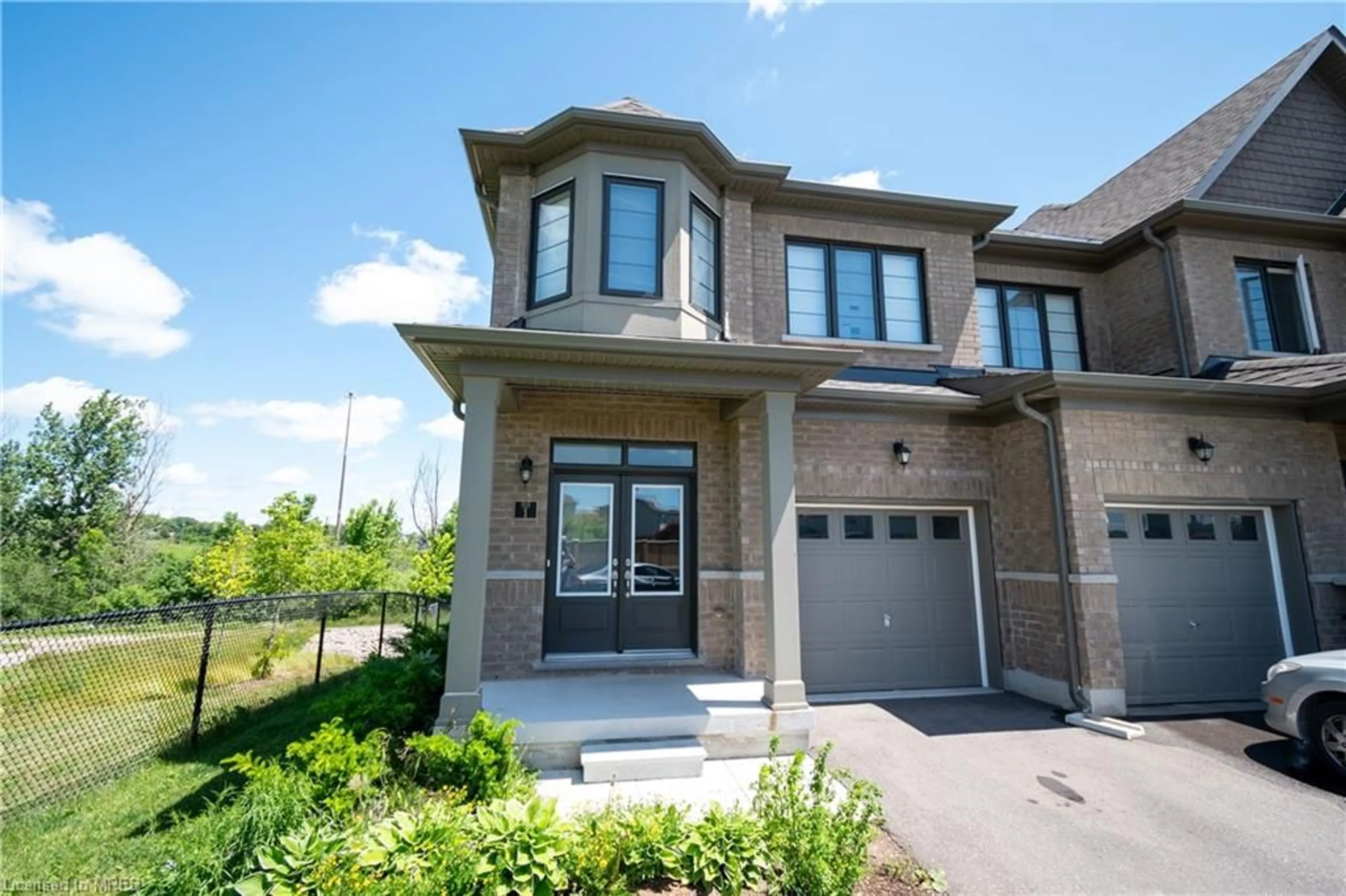 Home with brick exterior material for 166 Deerpath Dr #1, Guelph Ontario N1K 0E2