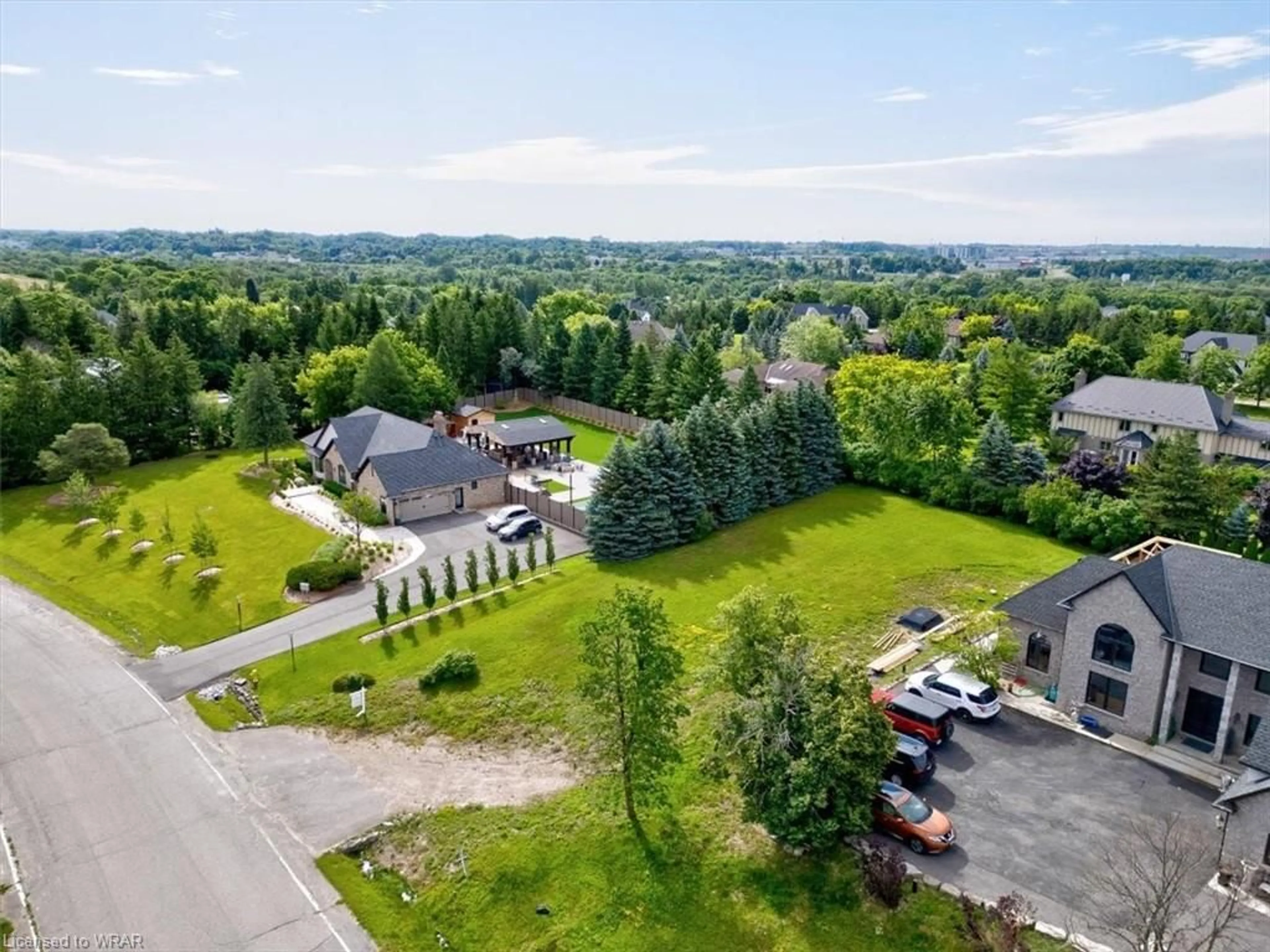 A pic from exterior of the house or condo, the fenced backyard for 151 Burnham Cres, Cambridge Ontario N3E 1B3