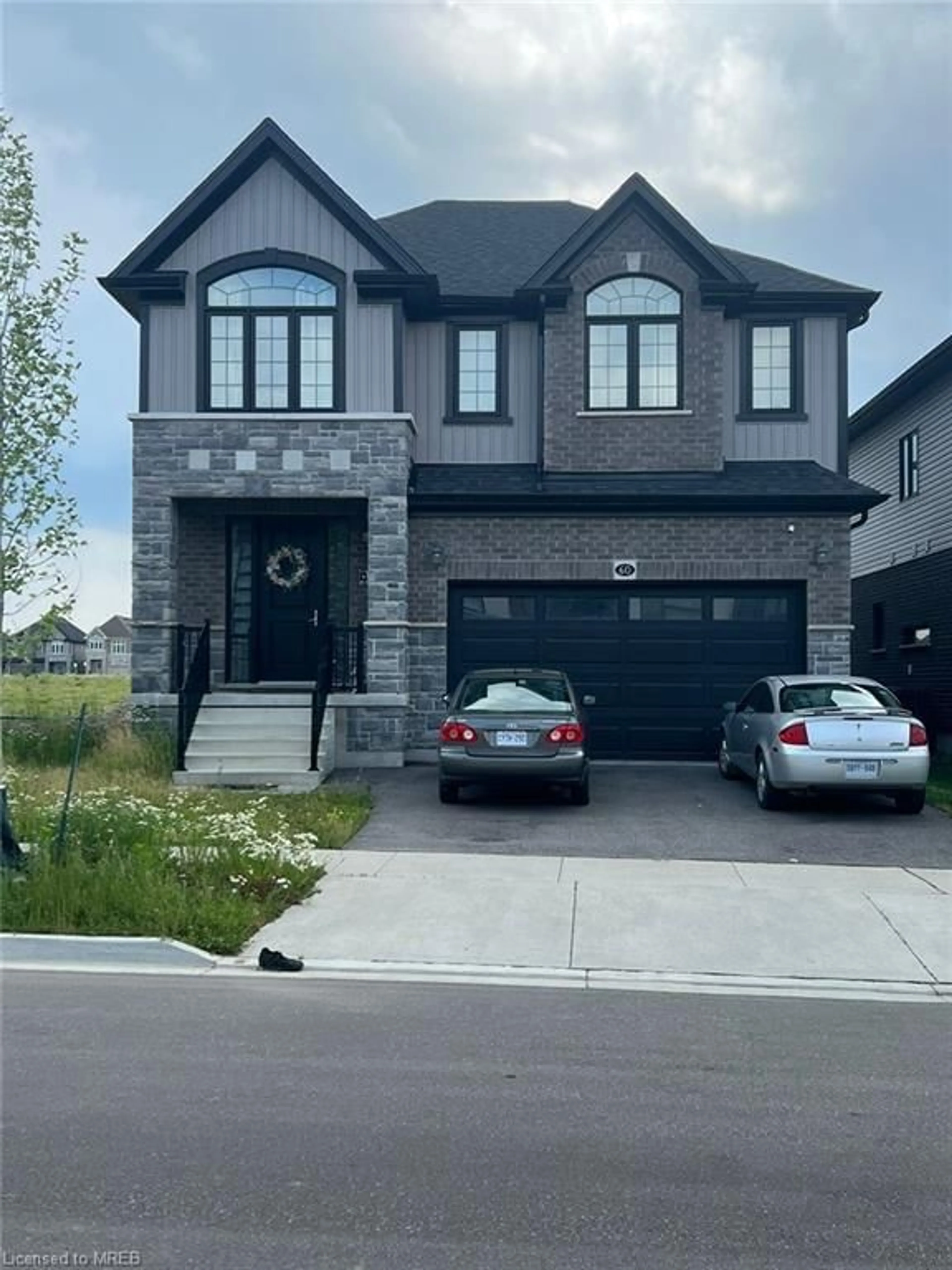 Frontside or backside of a home for 60 Monarch Woods Dr, Waterloo Ontario N2P 0K1