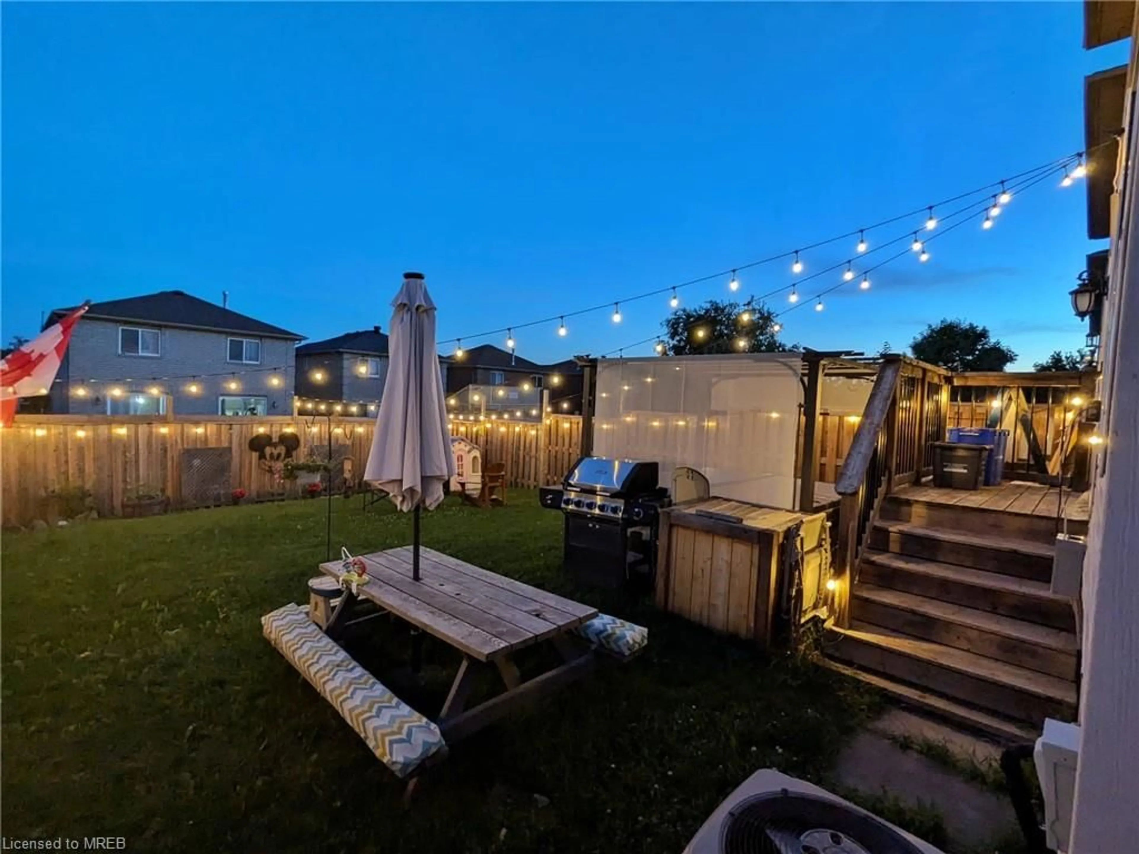 Patio, the fenced backyard for 48 Dunsmore Lane, Barrie Ontario L4M 6Z9