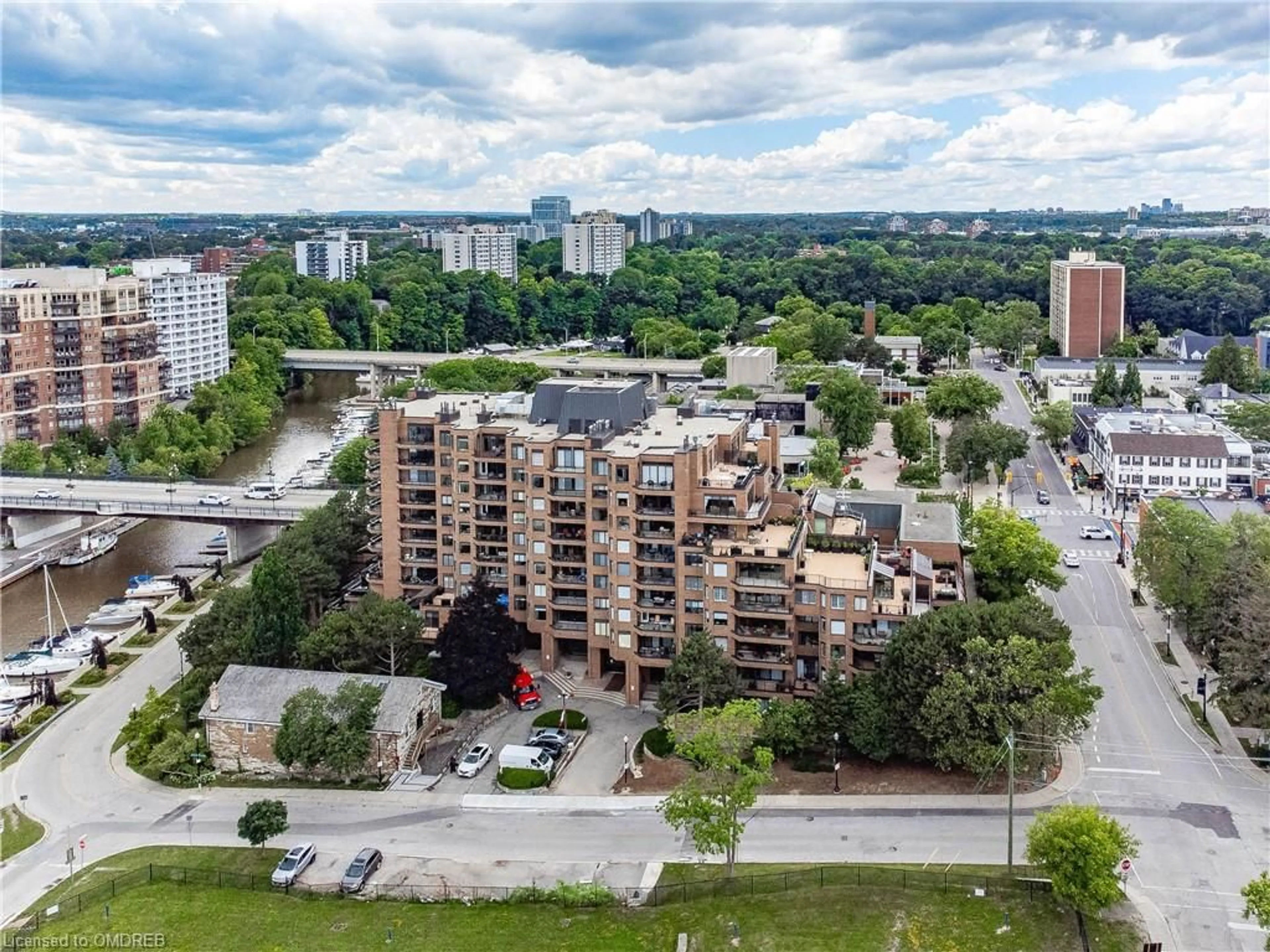 A pic from exterior of the house or condo, the view of city buildings for 100 Lakeshore Rd #1104, Oakville Ontario L6J 6M9