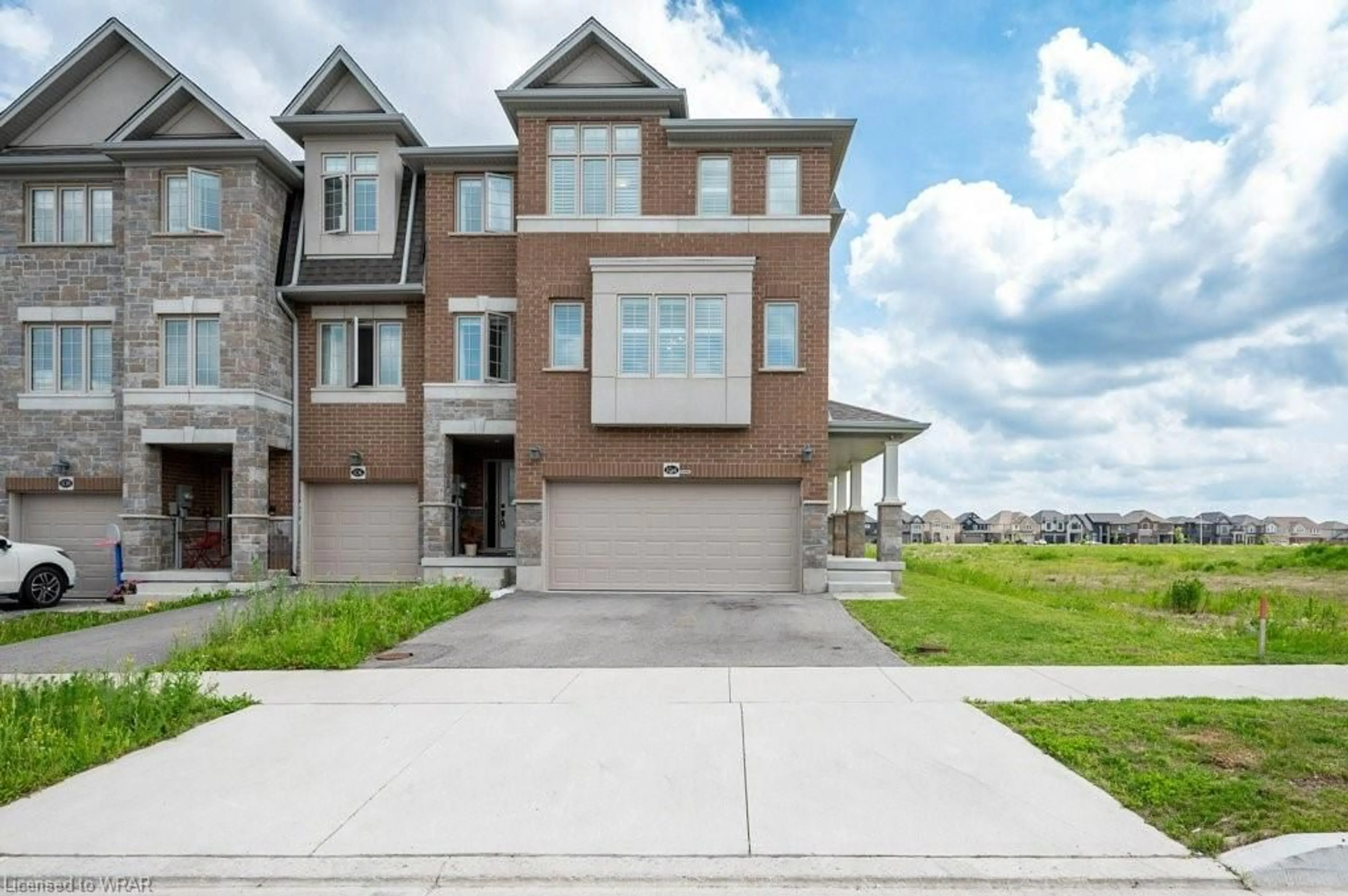 A pic from exterior of the house or condo for 104 Monarch Woods Dr, Kitchener Ontario N2P 0K3