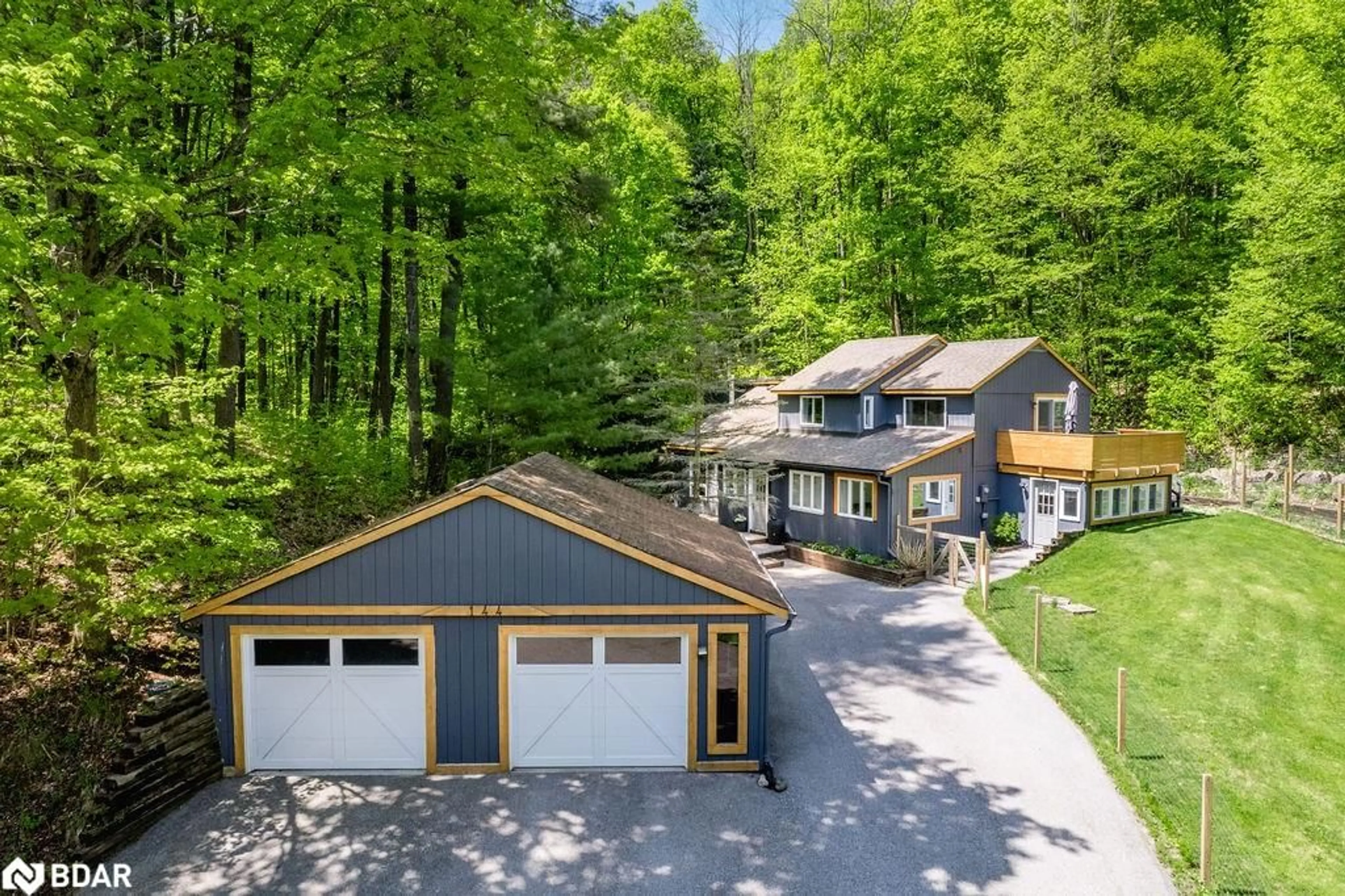 Frontside or backside of a home for 144 Huronwoods Dr, Oro-Medonte Ontario L0K 1E0