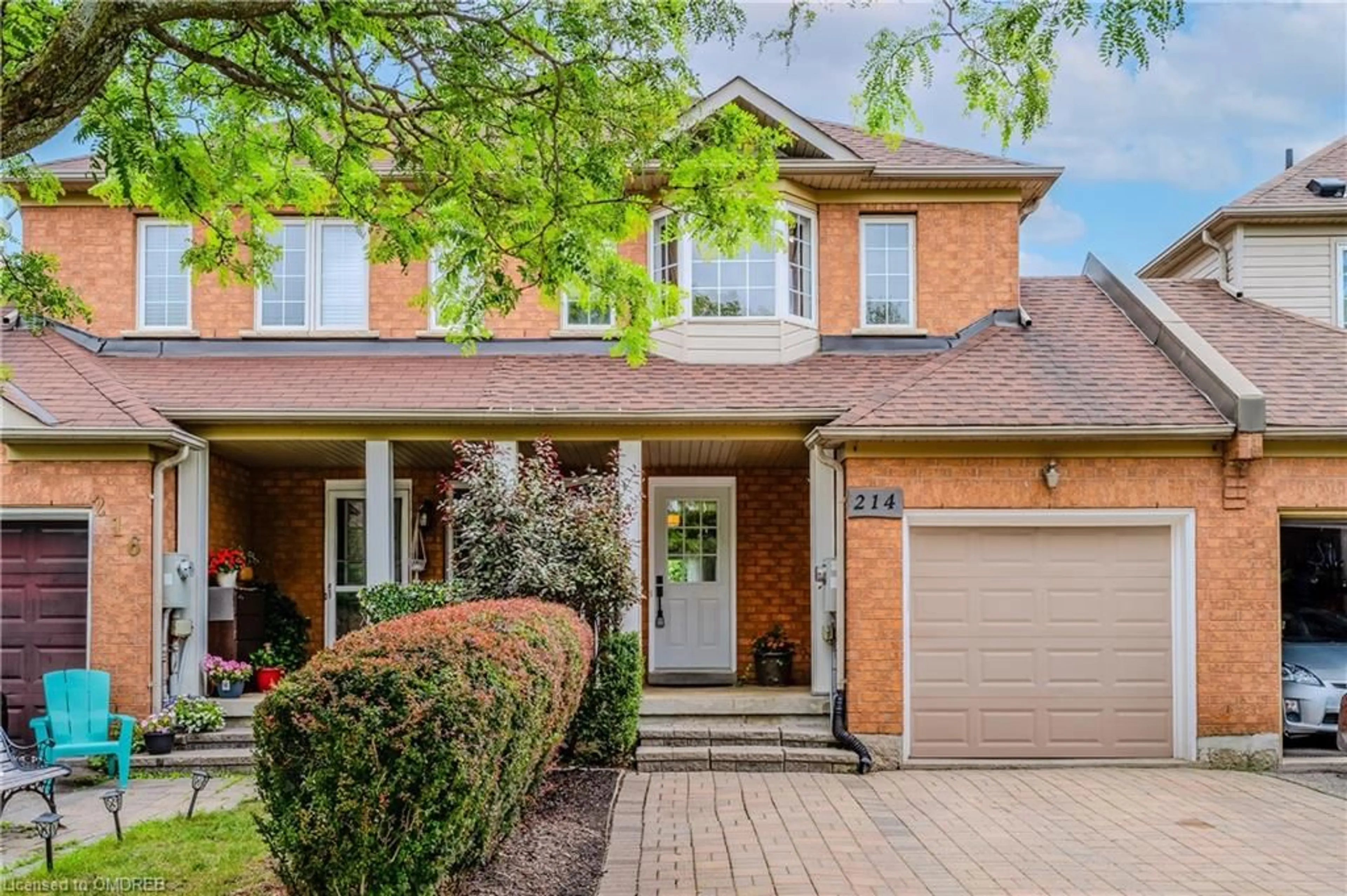Home with brick exterior material for 214 Hampshire Way, Milton Ontario L9T 6B9