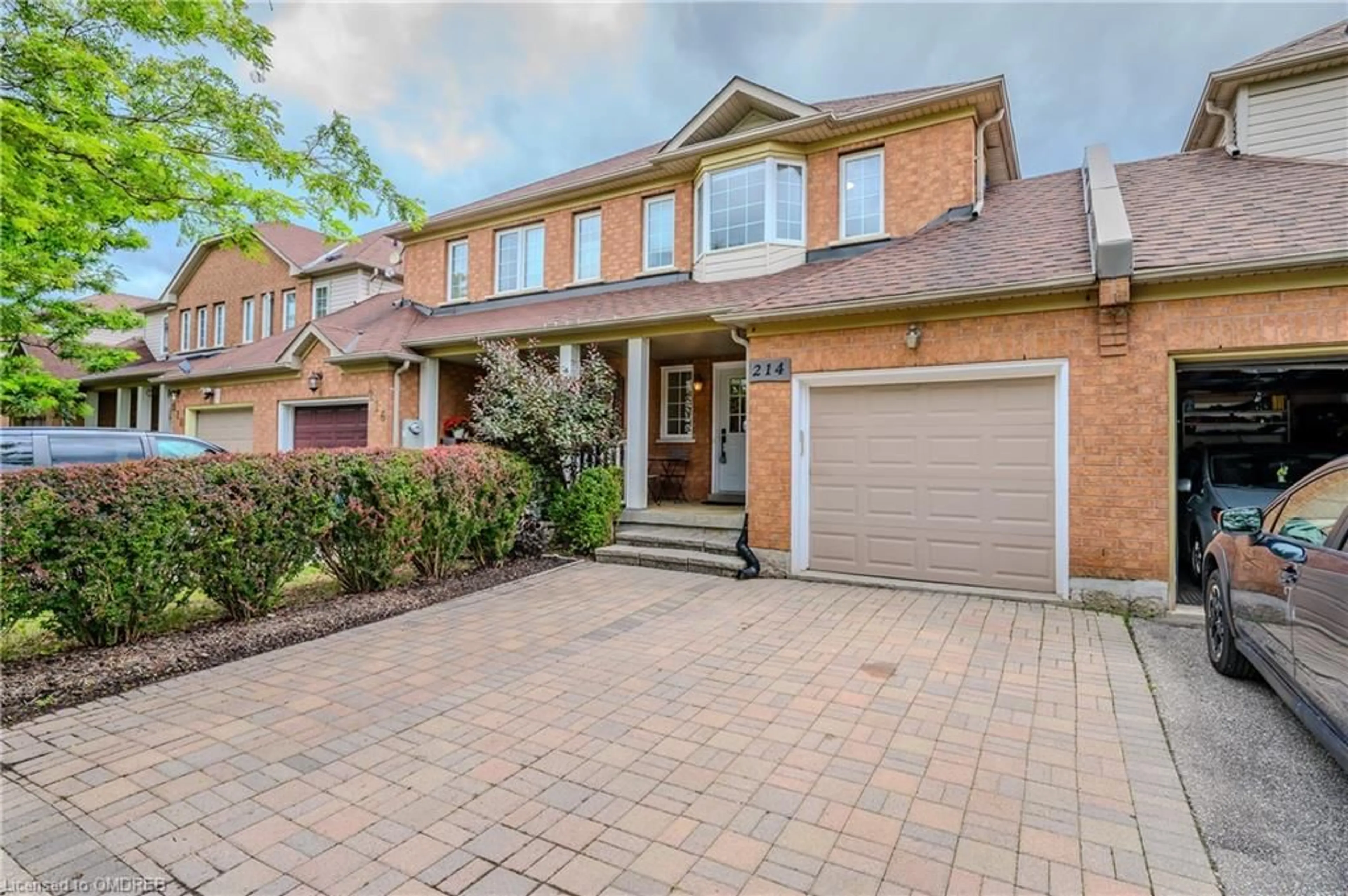 Home with brick exterior material for 214 Hampshire Way, Milton Ontario L9T 6B9