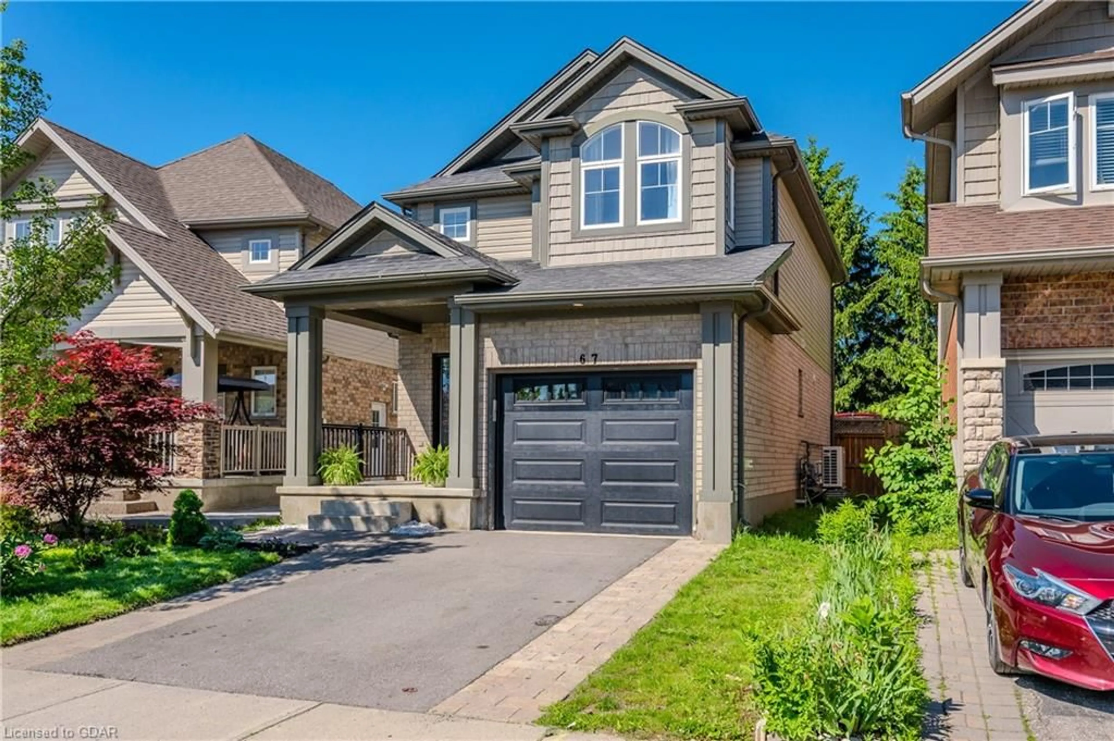 Frontside or backside of a home for 67 Laughland Lane, Guelph Ontario N1L 0C6