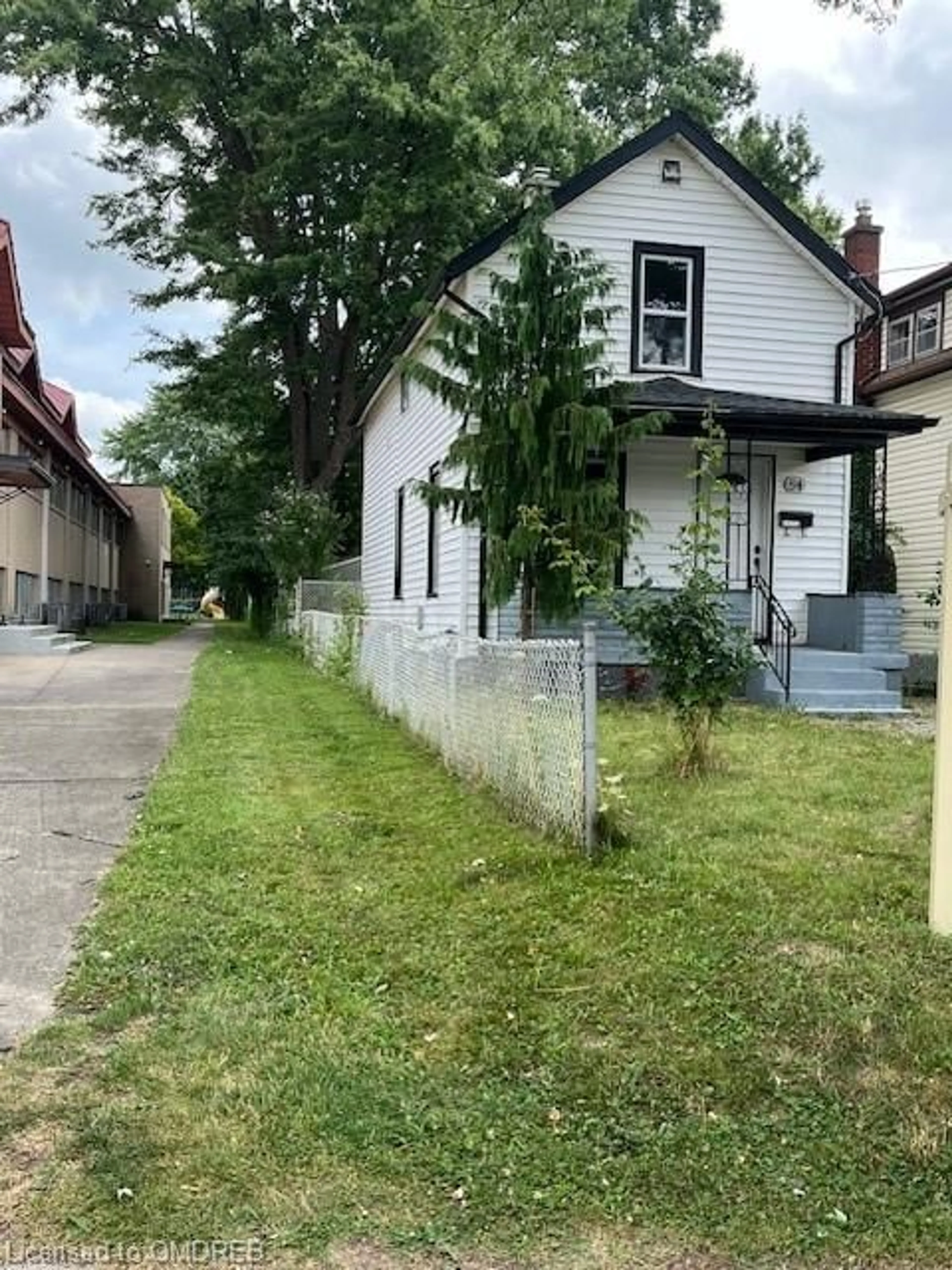 Frontside or backside of a home, the fenced backyard for 84 Empire St, Welland Ontario L3B 2L4