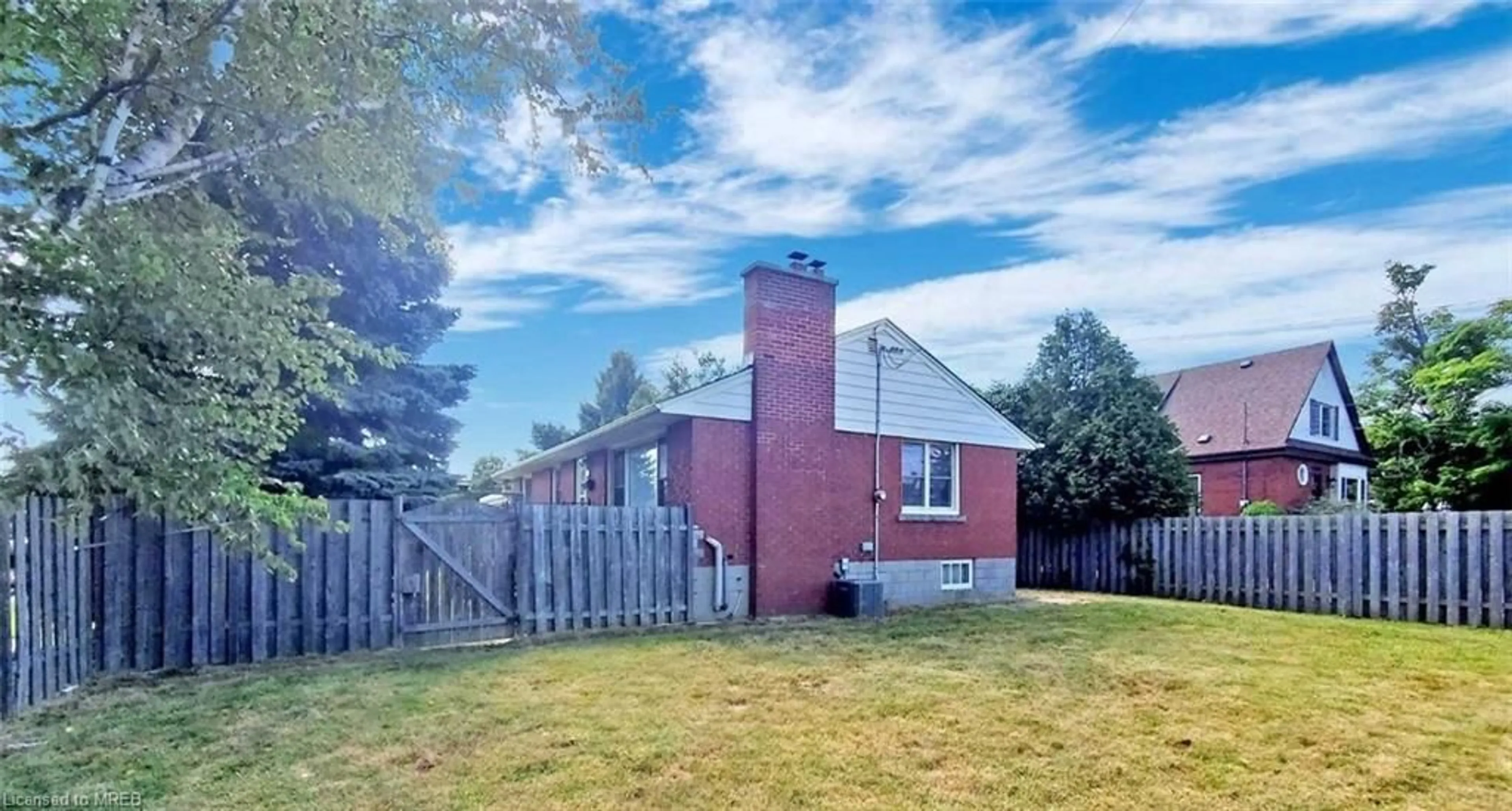 A pic from exterior of the house or condo, the fenced backyard for 103 Chester Ave, Hamilton Ontario L9C 2W7