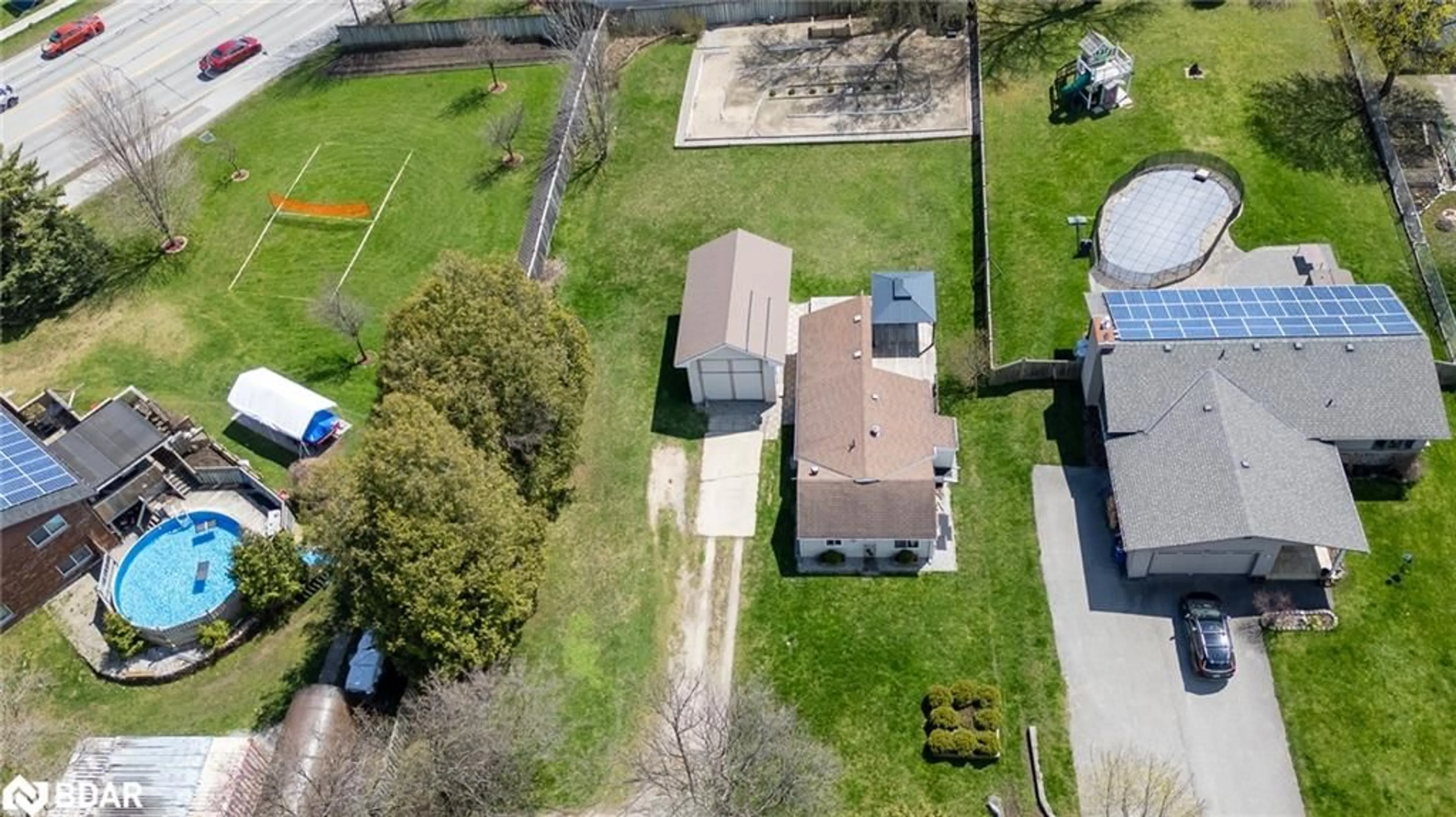 Frontside or backside of a home, the fenced backyard for 261 Harvie Rd, Barrie Ontario L4N 8J5