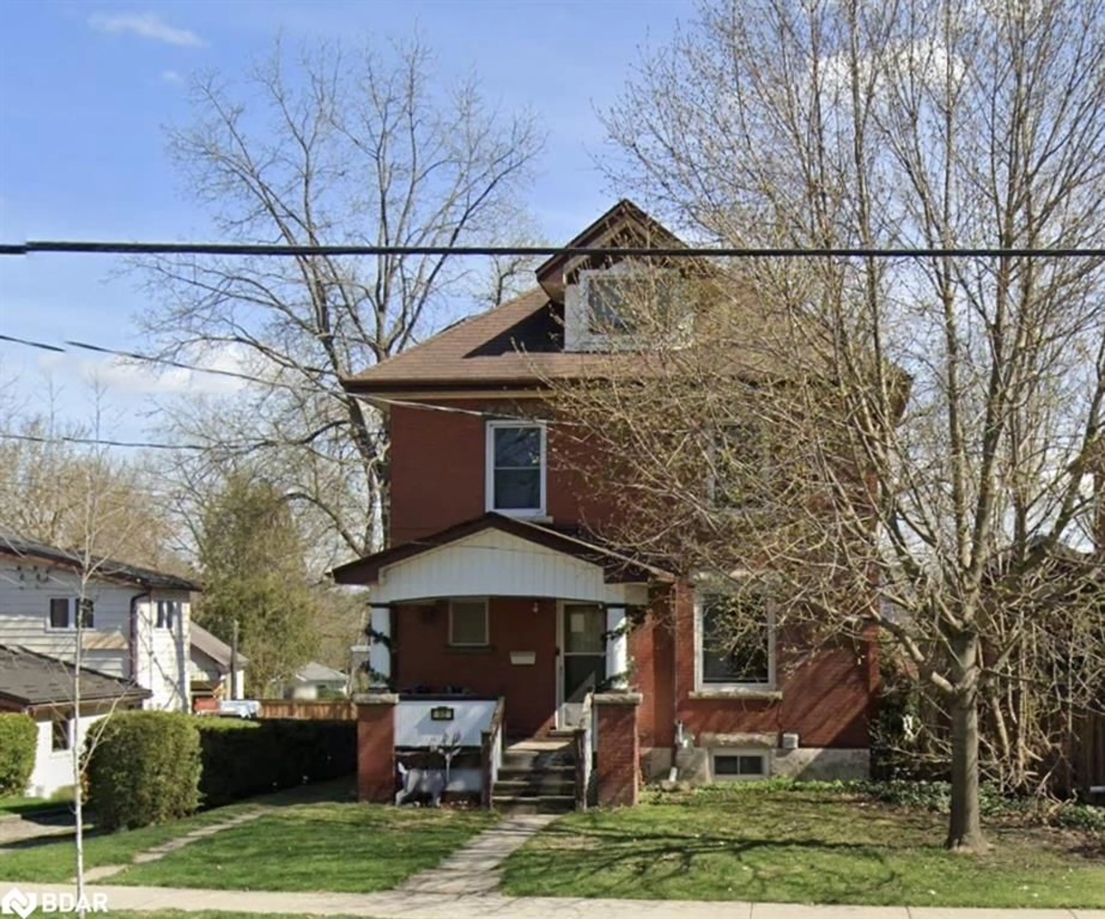 Frontside or backside of a home for 52 Waterloo Ave, Guelph Ontario N1H 3H5