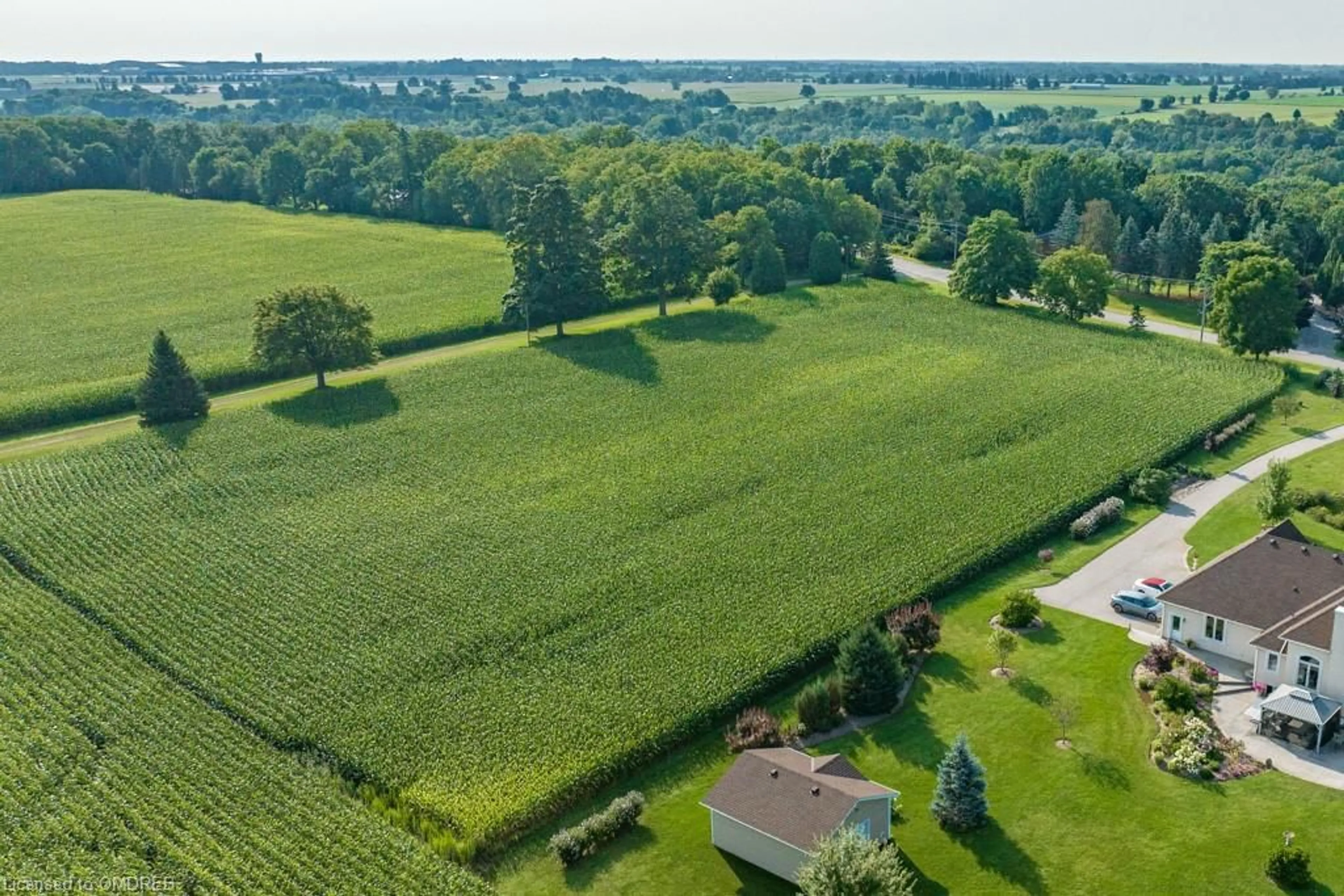 A pic from exterior of the house or condo, the fenced backyard for 361 Robinson Rd, Burford Ontario N3R 0B8