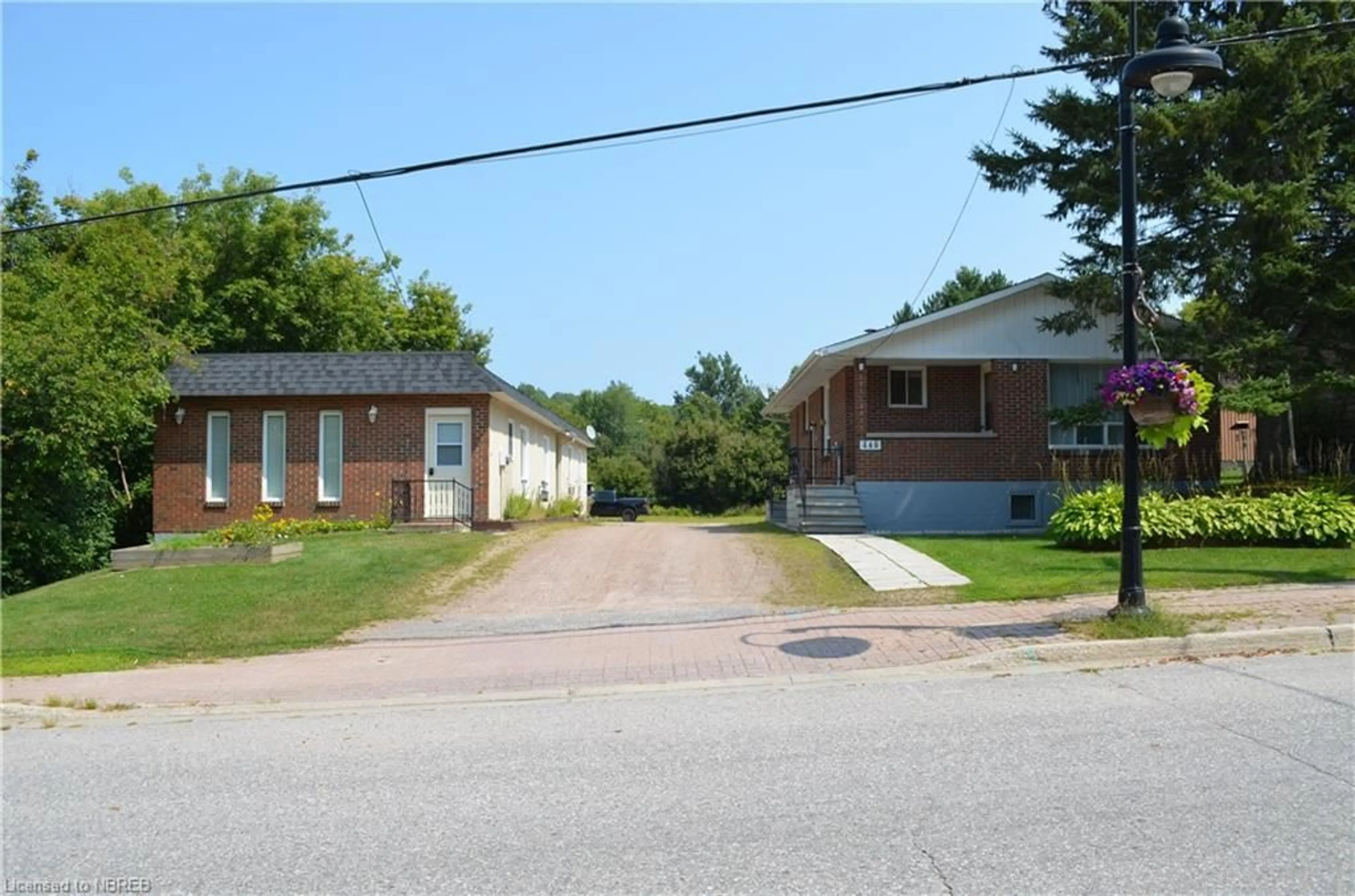 Frontside or backside of a home, the front or back of building for 448 Main St #A,B,C & 448, Powassan Ontario P0H 1Z0