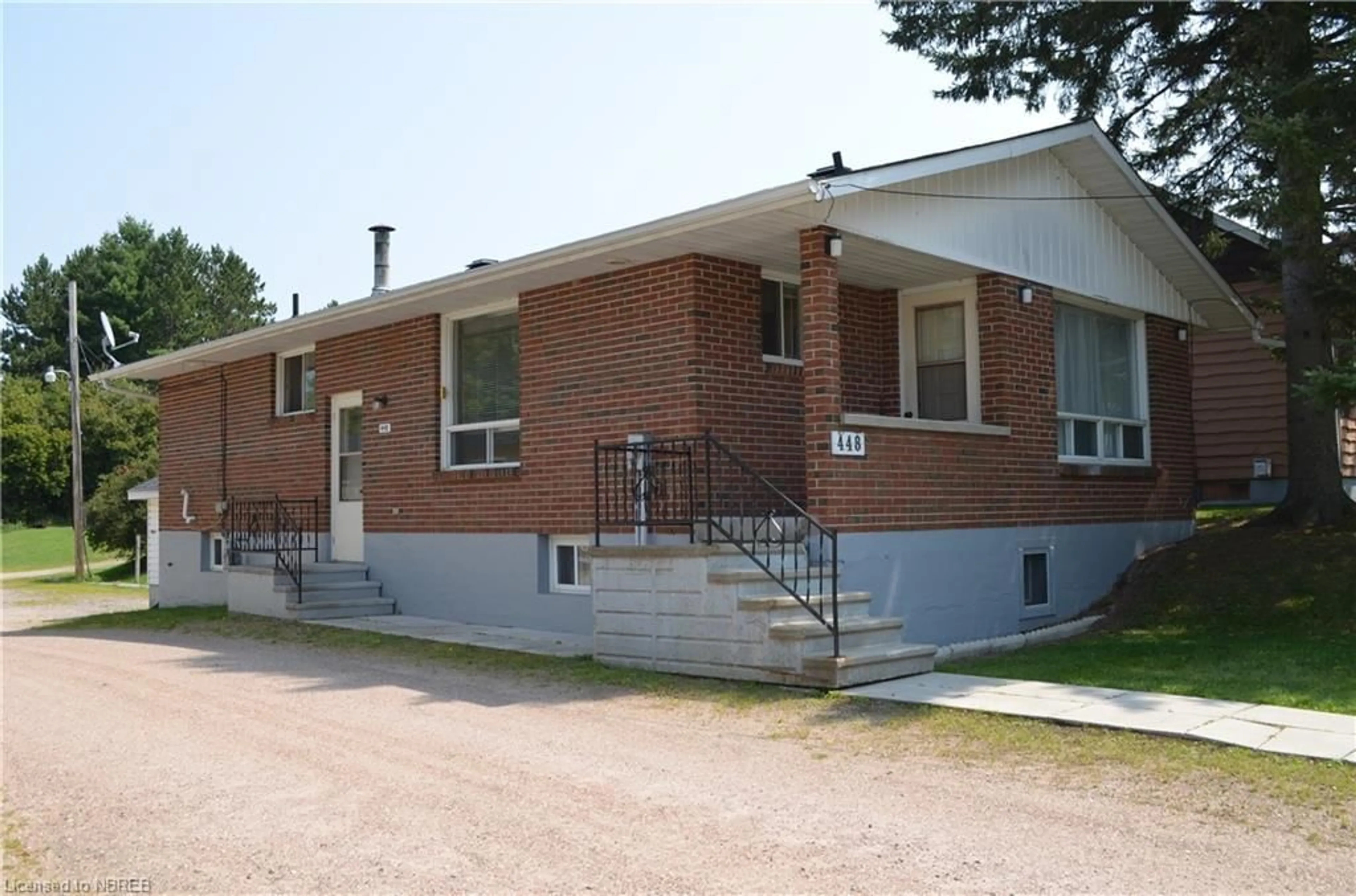 Home with brick exterior material for 448 Main St #A,B,C & 448, Powassan Ontario P0H 1Z0