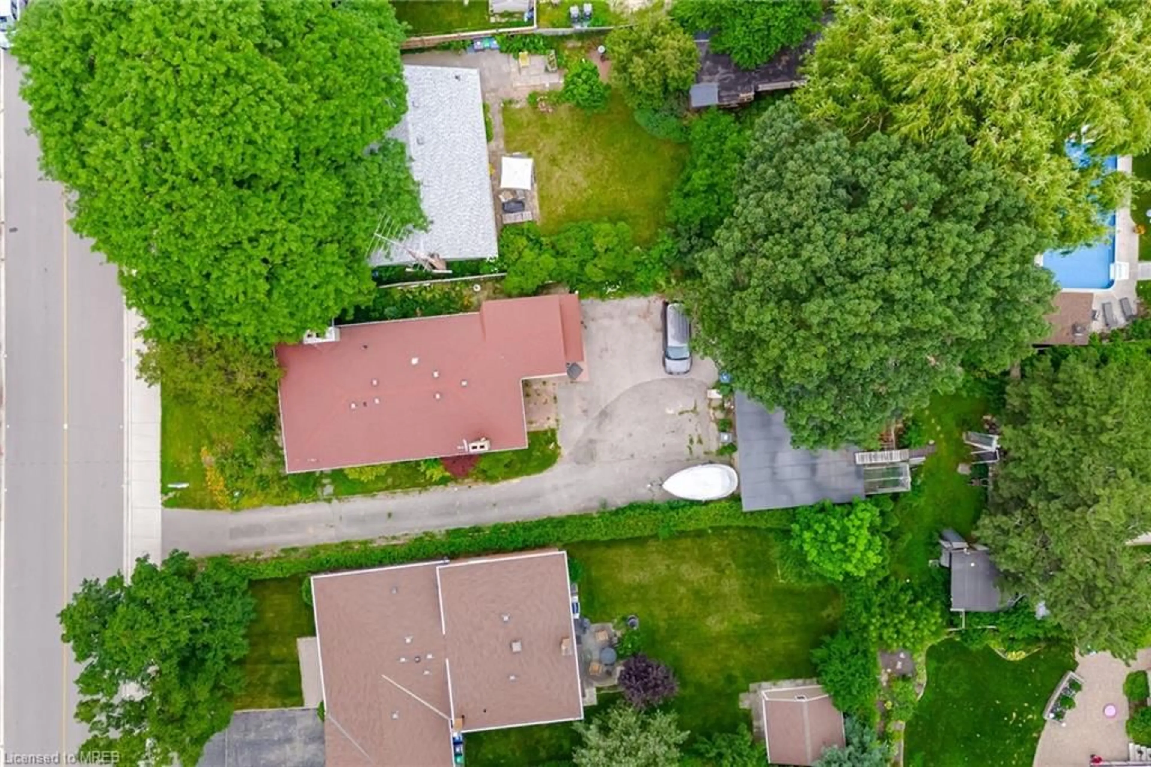 Frontside or backside of a home, the fenced backyard for 1635 Kenmuir Ave, Mississauga Ontario L5G 4B6