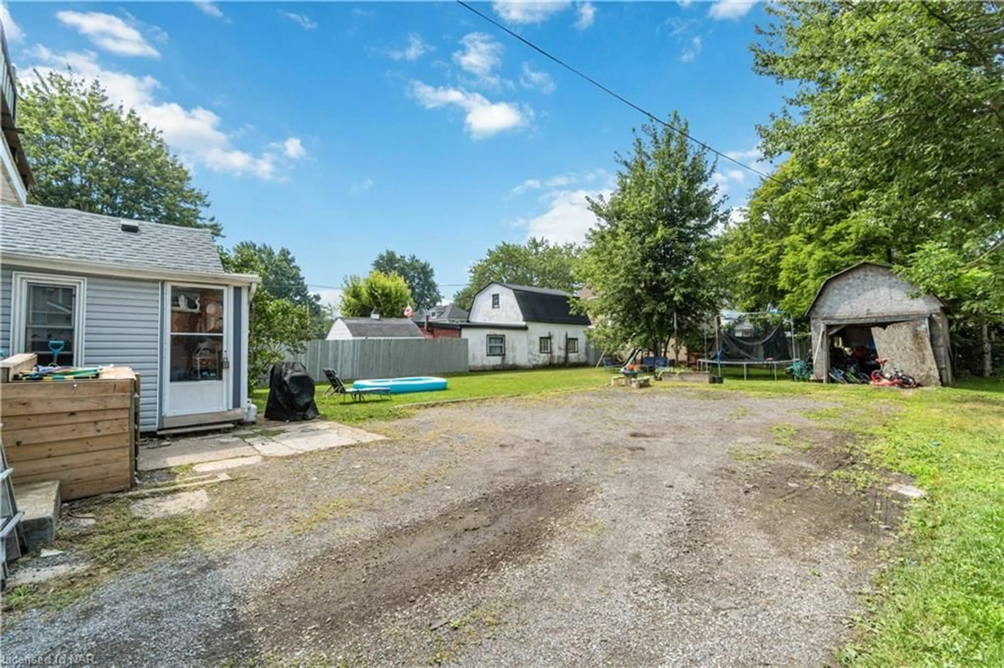 Frontside or backside of a home, the fenced backyard for 640 King St, Port Colborne Ontario L3K 4H8