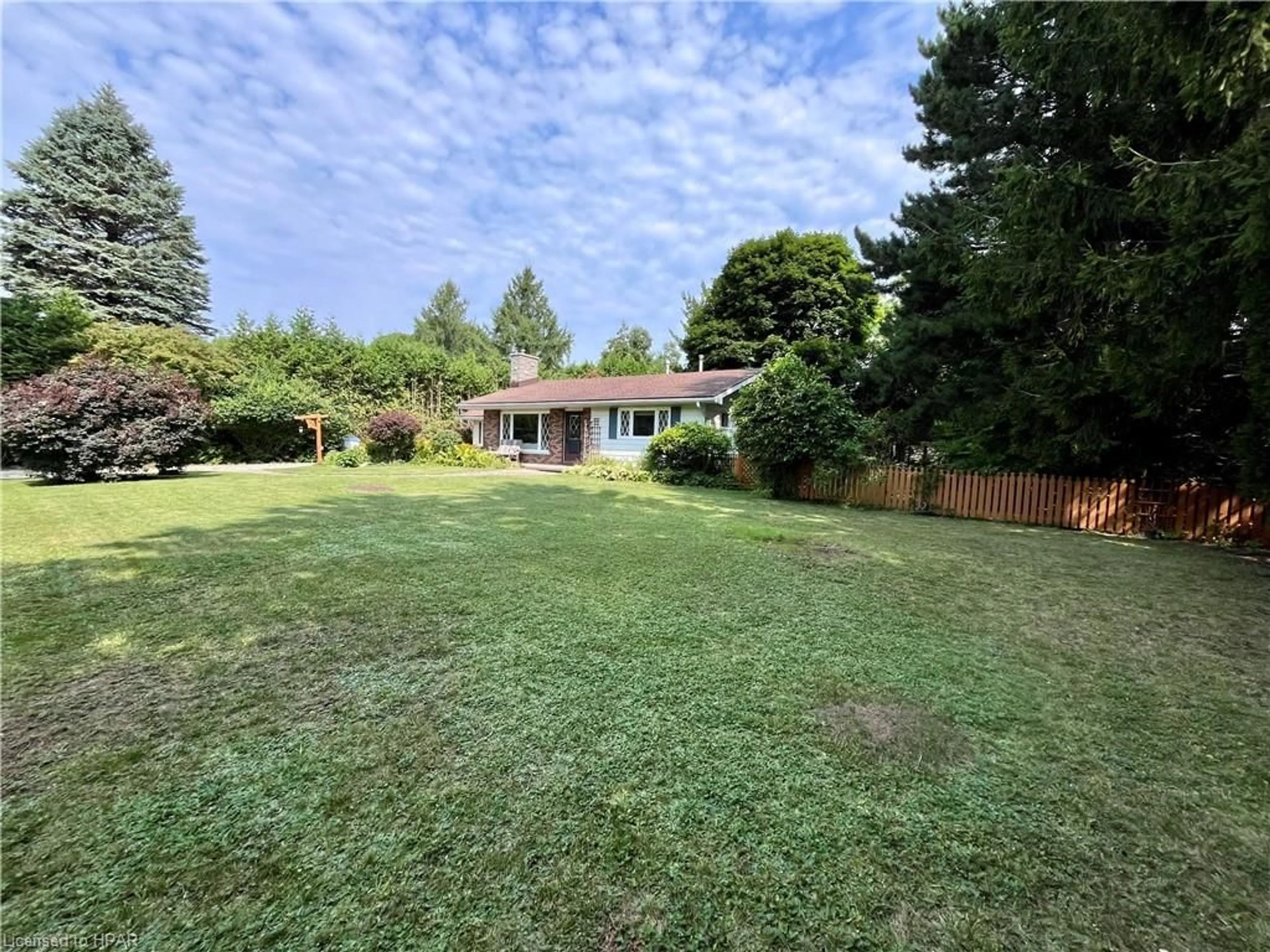 Frontside or backside of a home, the fenced backyard for 59 Cameron St, Bayfield Ontario N0M 1G0