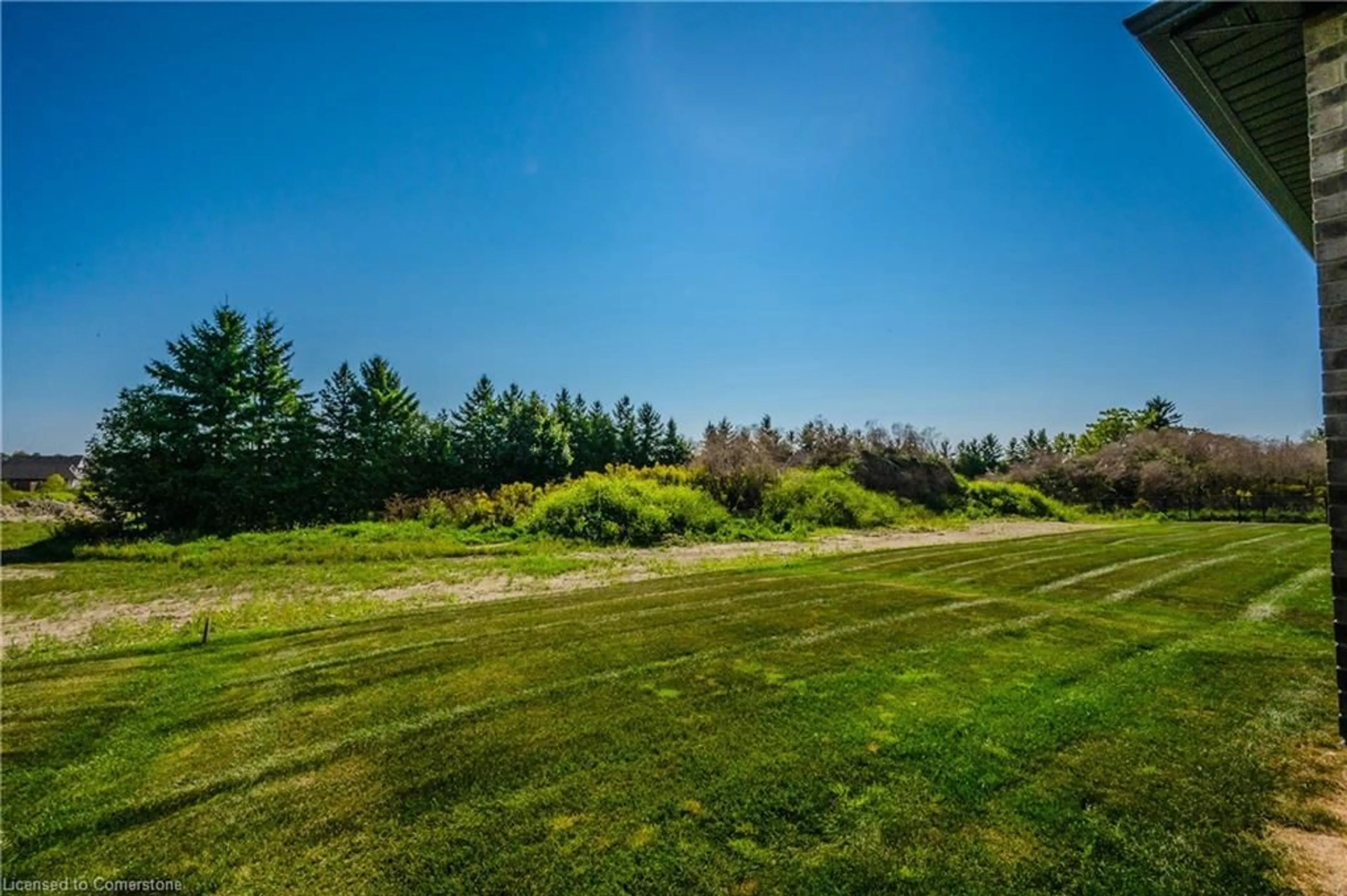 A pic from exterior of the house or condo, the fenced backyard for 55 Country Club Estates Dr, Elmira Ontario N3B 0B4