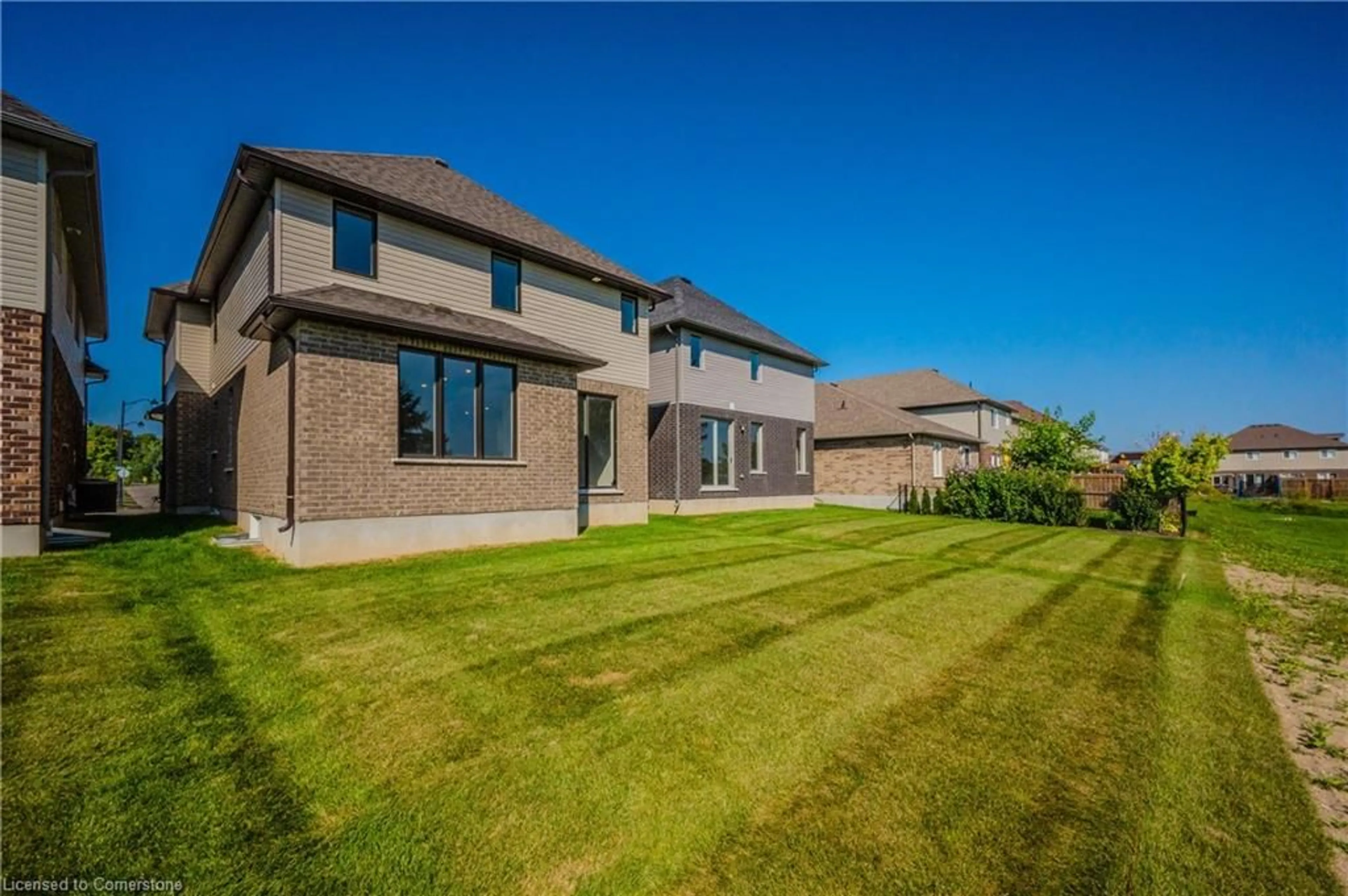 Frontside or backside of a home, the fenced backyard for 63 Country Club Estates Dr, Elmira Ontario N3B 1N3