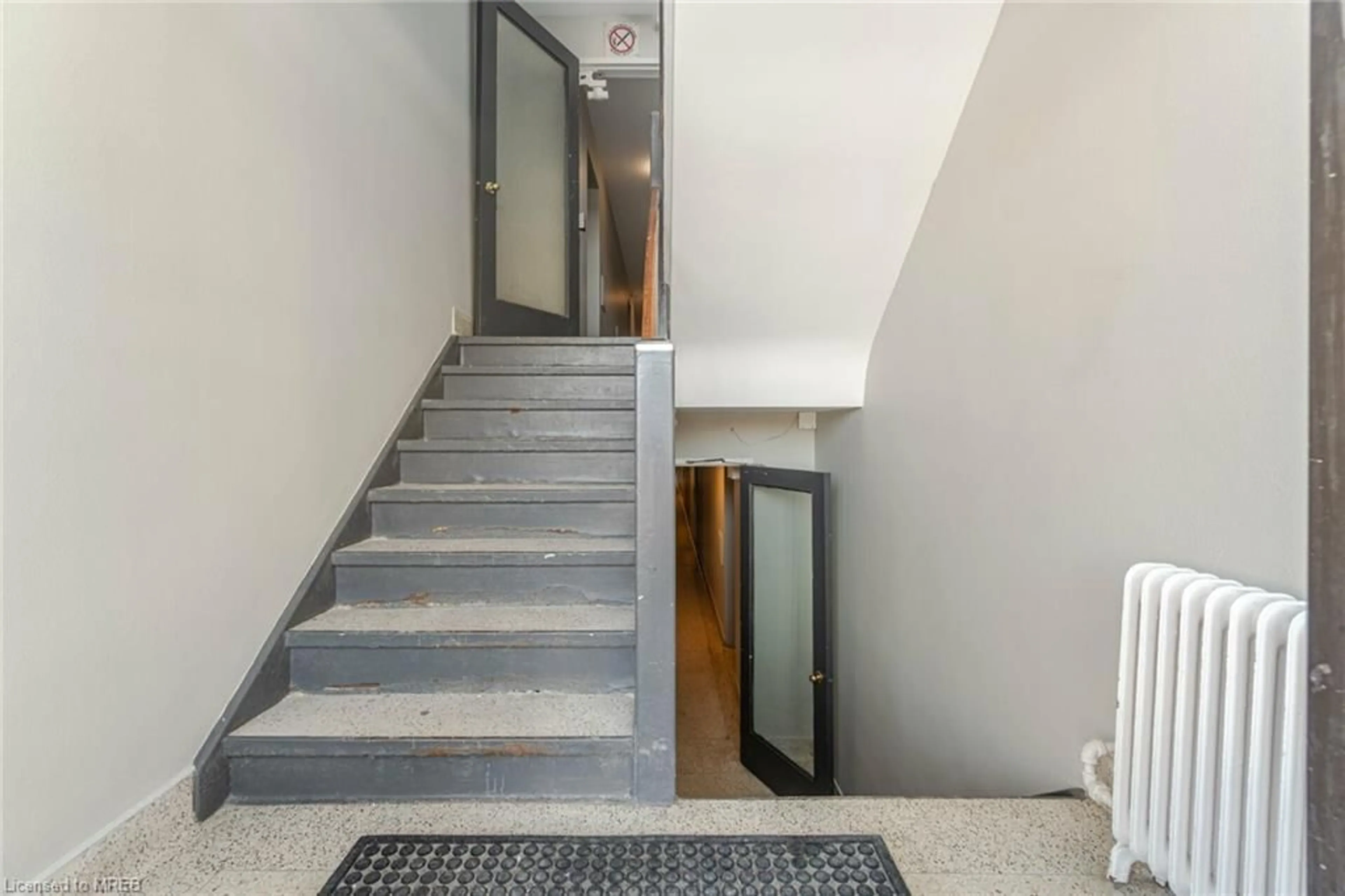 Indoor foyer, cement floor for 57 Mericourt Rd #103, Hamilton Ontario L8S 2N5